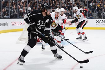 LOS ANGELES, CA - FEBRUARY 26: Anze Kopitar #11 of the Los Angeles Kings handles the puck against Patrick Wiercioch #46 of the Ottawa Senators at STAPLES Center on February 26, 2015 in Los Angeles, California. (Photo by Aaron Poole/NHLI via Getty Images)