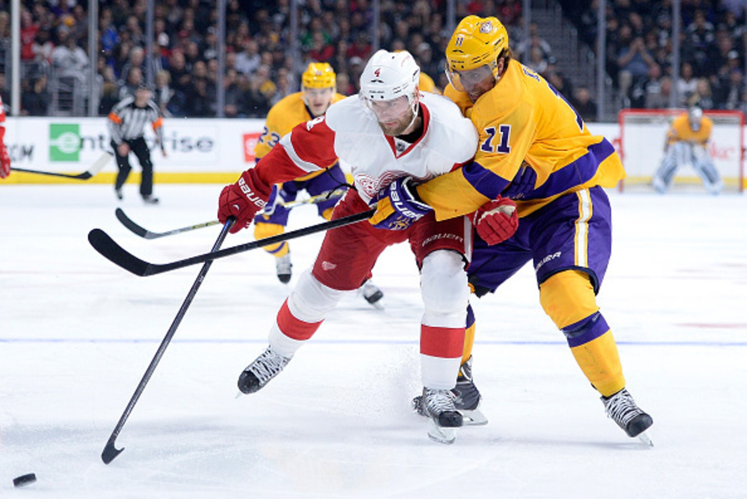 LOS ANGELES, CA - FEBRUARY 24:  Jakub Kindl #4 of the Detroit Red Wings fends off Anze Kopitar #11 of the Los Angeles Kings at Staples Center on February 24, 2015 in Los Angeles, California.  (Photo by Harry How/Getty Images)