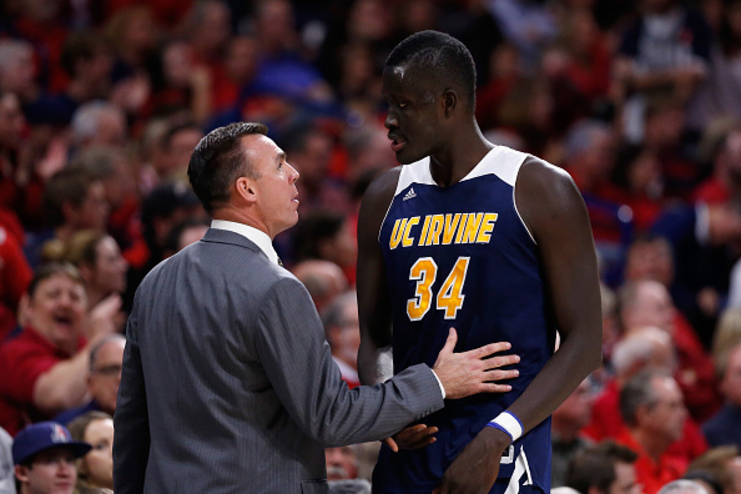 TUCSON, AZ - NOVEMBER 19:  Head coach Russell Turner of the UC Irvine Anteaters talks with Mamadou Ndiaye #34 during the second half of the college basketball game against the Arizona Wildcats at McKale Center on November 19, 2014 in Tucson, Arizona. The 