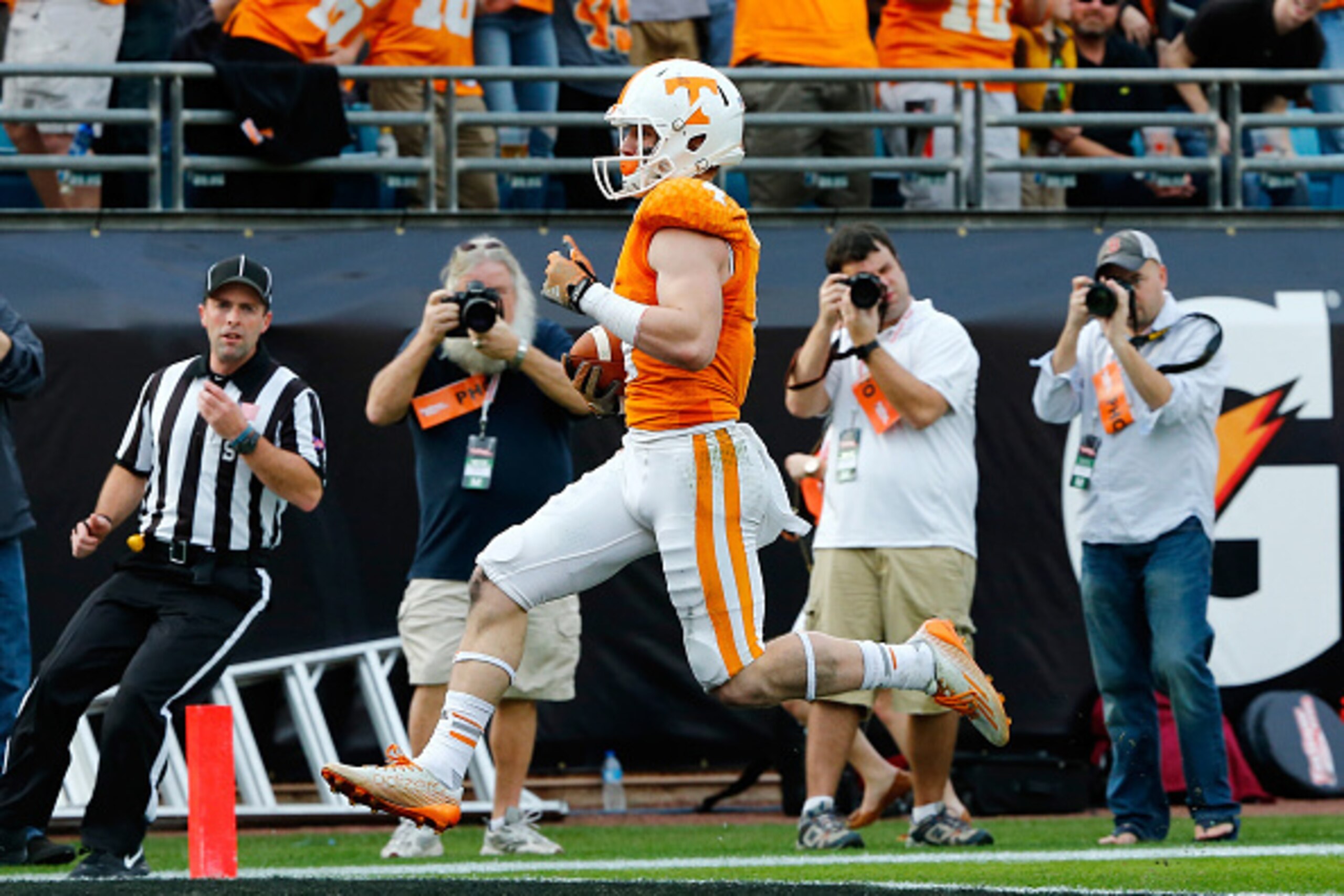 JACKSONVILLE, FL - JANUARY 02:  Vic Wharton #4 of the Tennessee Volunteers crosses the goal line for a touchdown during the TaxSlayer Bowl against the Iowa Hawkeyes at EverBank Field on January 2, 2015 in Jacksonville, Florida.  (Photo by Sam Greenwood/Ge