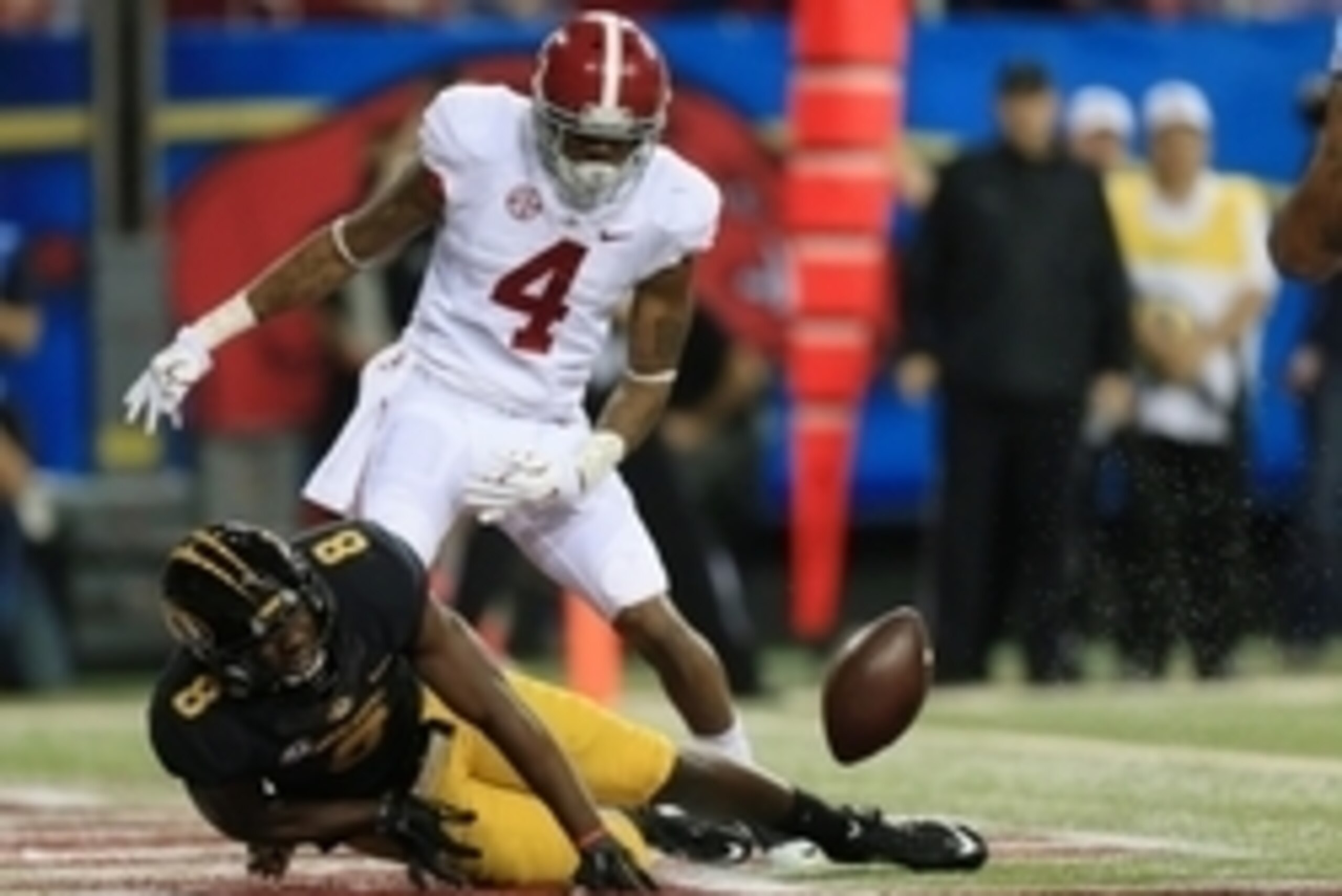 Dec 6, 2014; Atlanta, GA, USA; Missouri Tigers wide receiver Darius White (8) fails to make a catch as Alabama Crimson Tide defensive back Eddie Jackson (4) defends during the third quarter of the 2014 SEC Championship Game at the Georgia Dome. Mandatory 