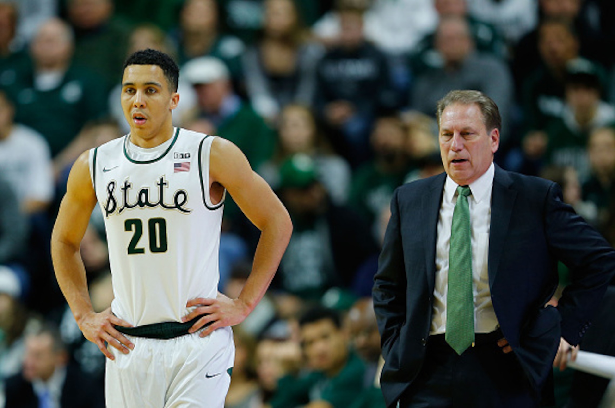 EAST LANSING, MI - DECEMBER 30:  Travis Trice #20 of the Michigan State Spartans brings the ball down the court during the first half of the game against the Maryland Terrapins at Breslin Center on December 30, 2014 in East Lansing, Michigan. Maryland def