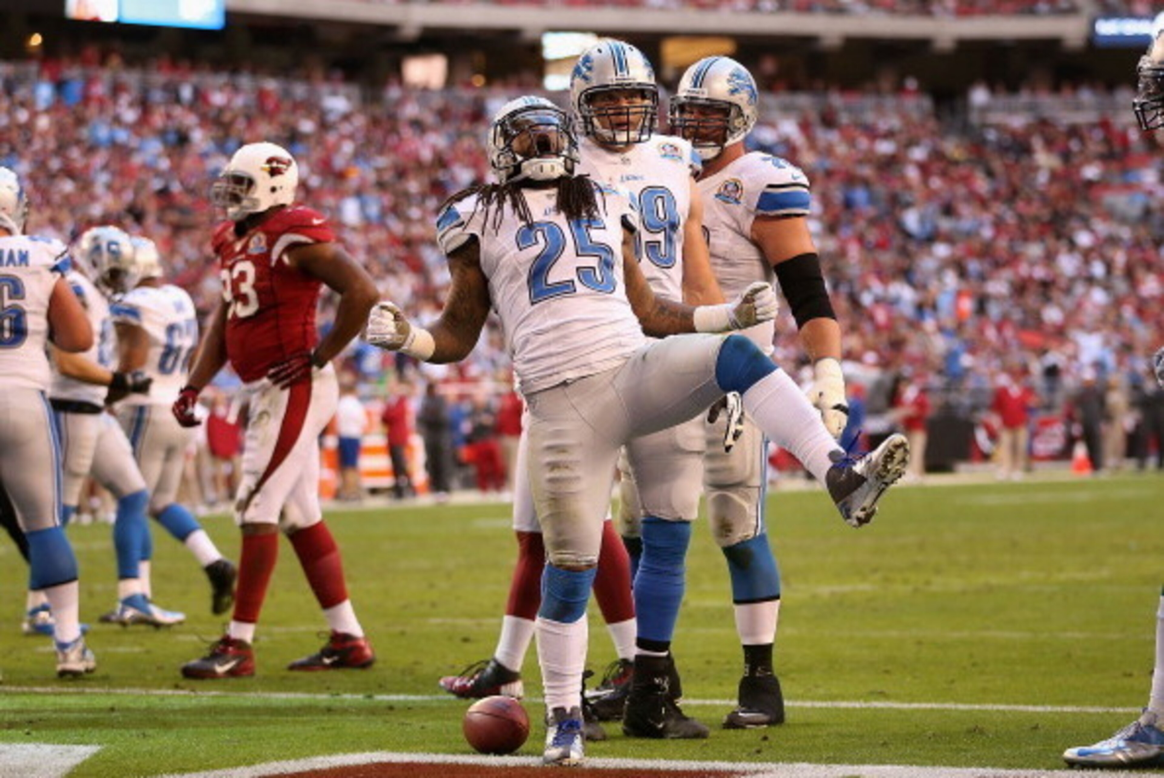 GLENDALE, AZ - DECEMBER 16:  Running back Mikel Leshoure #25 of the Detroit Lions celebrates after scoring a 1 yard rushing touchdown against the Arizona Cardinals during the second quarter of the NFL game at the University of Phoenix Stadium on December 