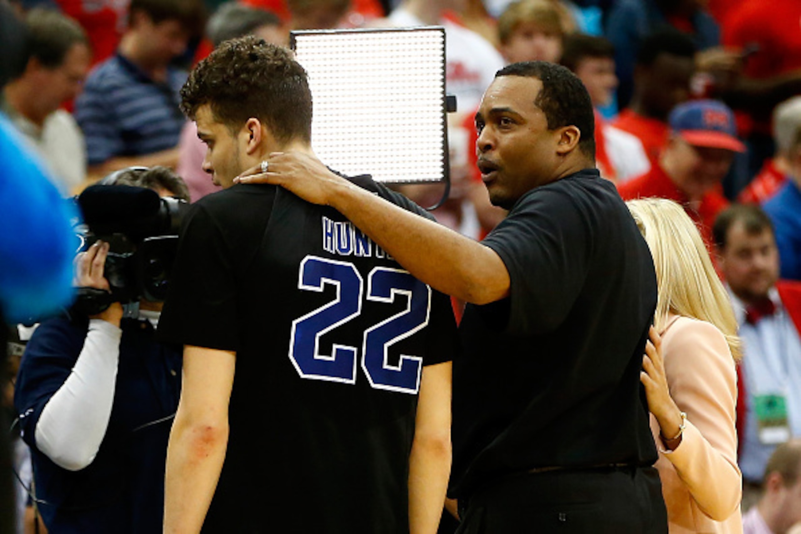JACKSONVILLE, FL - MARCH 19:  Head coach Ron Hunter of the Georgia State Panthers puts his arm around son and player R.J. Hunter #22 after the Panthers 57-56 win against the Baylor Bears during the second round of the 2015 NCAA Men's Basketball Tournament