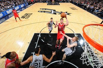 SAN ANTONIO, TX - DECEMBER 28:  Donatas Motiejunas #20 of the Houston Rockets shoots the ball against the San Antonio Spurs during the game on December 28, 2014 at the AT&T Center in San Antonio, Texas. NOTE TO USER: User expressly acknowledges and agrees