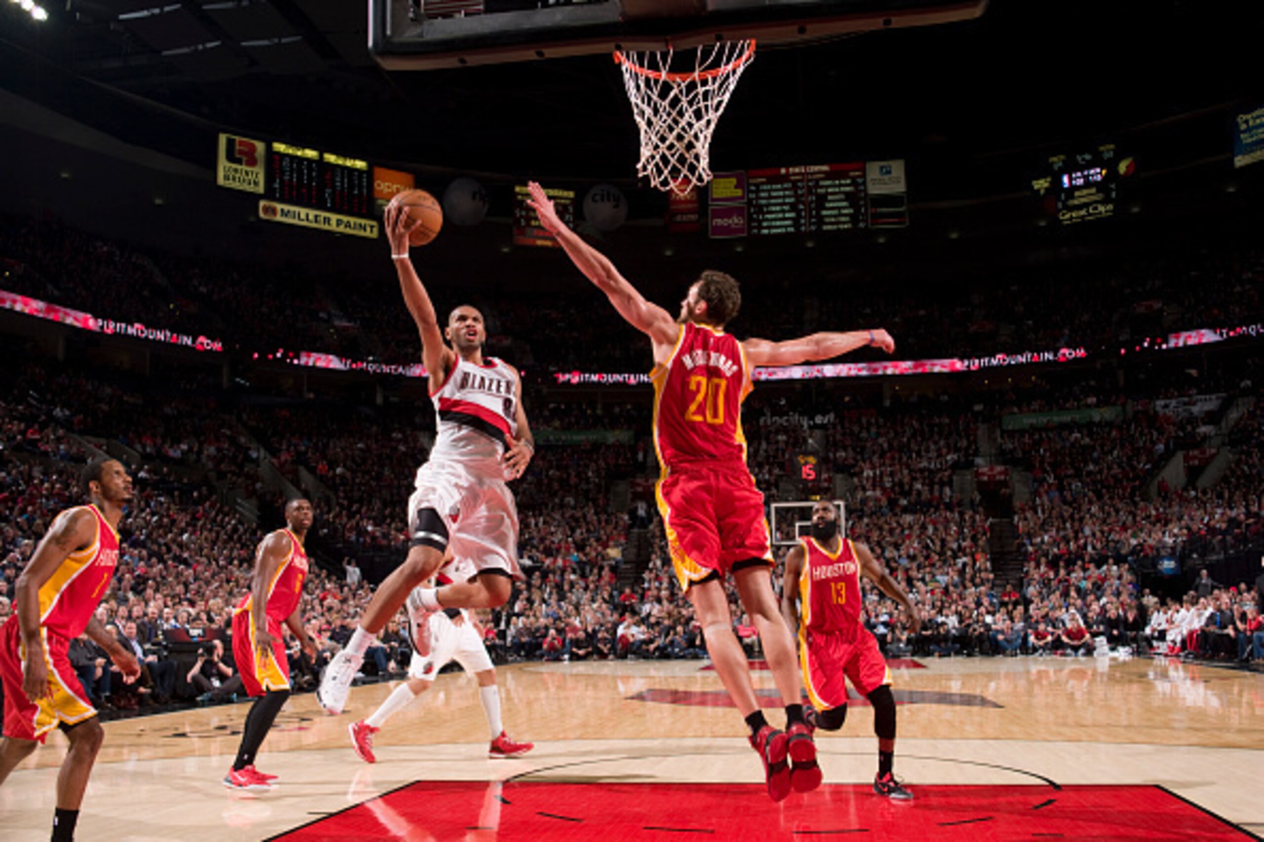 PORTLAND, OR - MARCH 11: Nicolas Batum #88 of the Portland Trail Blazers shoots against the Houston Rockets on March 11, 2015 at the Moda Center Arena in Portland, Oregon. NOTE TO USER: User expressly acknowledges and agrees that, by downloading and or us