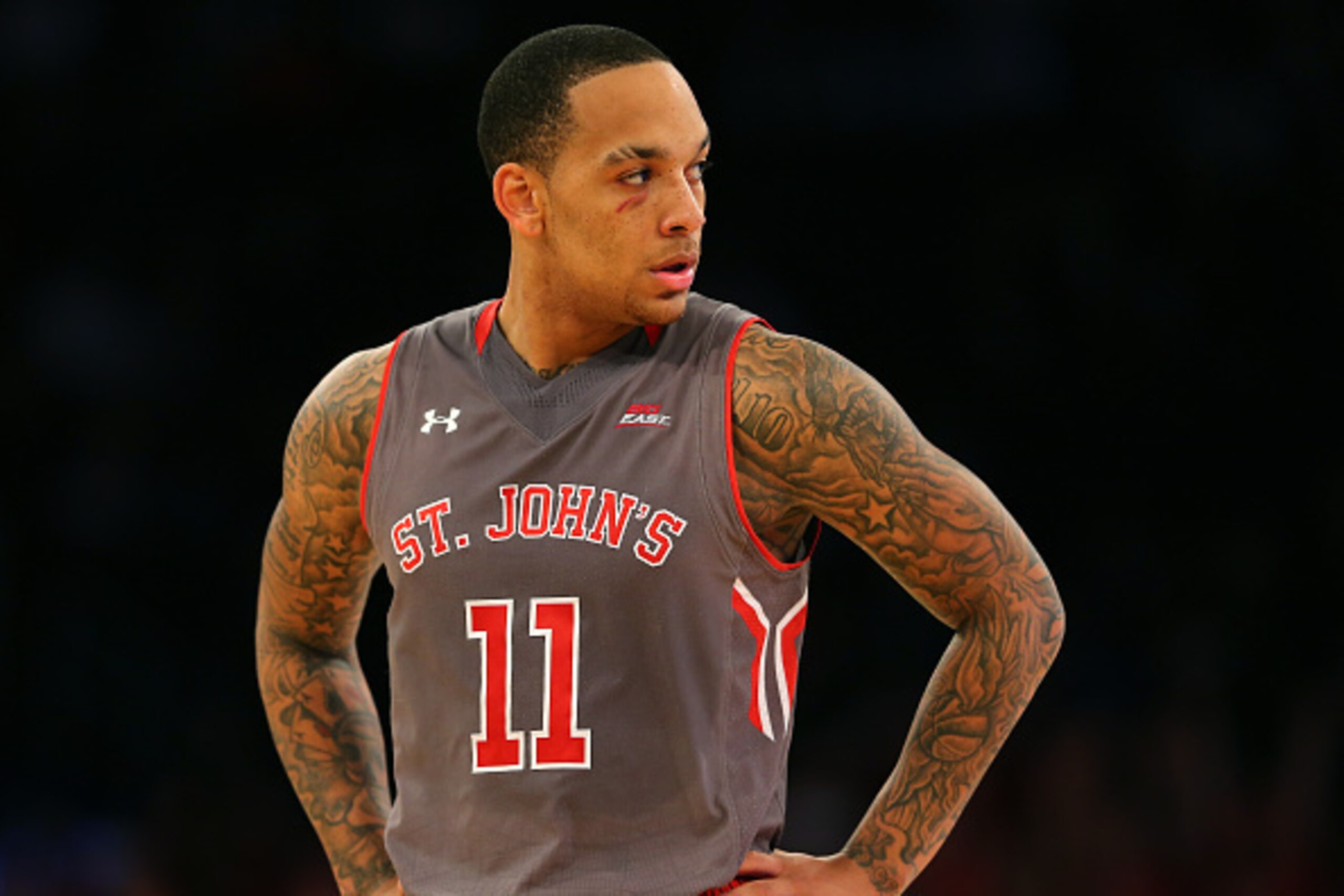 NEW YORK, NY - MARCH 12:  D'Angelo Harrison #11 of the St. John's Red Storm  looks on during a stop in play in the second half against the Providence Friars during a quarterfinal game of the Big East basketball tournament at Madison Square Garden on March