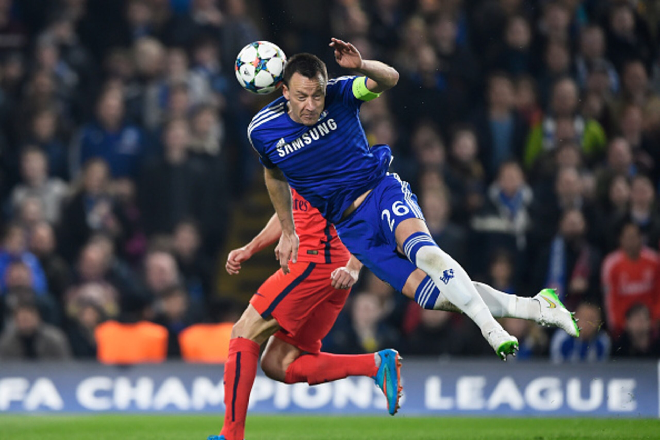 LONDON, ENGLAND - MARCH 11:  John Terry of Chelsea heads the ball clear during the UEFA Champions League Round of 16, second leg match between Chelsea and Paris Saint-Germain at Stamford Bridge on March 11, 2015 in London, England.  (Photo by Mike Hewitt/