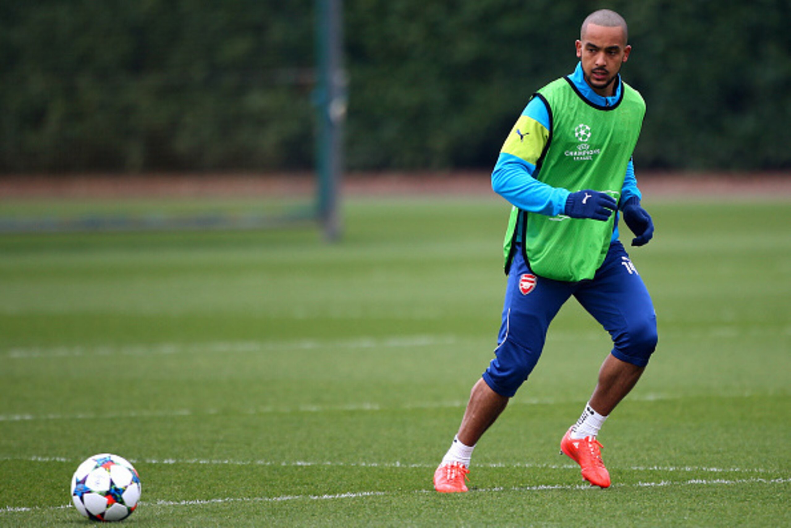 ST ALBANS, ENGLAND - MARCH 16: Arsenal's Theo Walcott warms up during the Arsenal Training Session ahead of their Champions League match against AS Monaco on March 16, 2015 in St Albans, England. (Photo by Charlie Crowhurst/Getty Images)