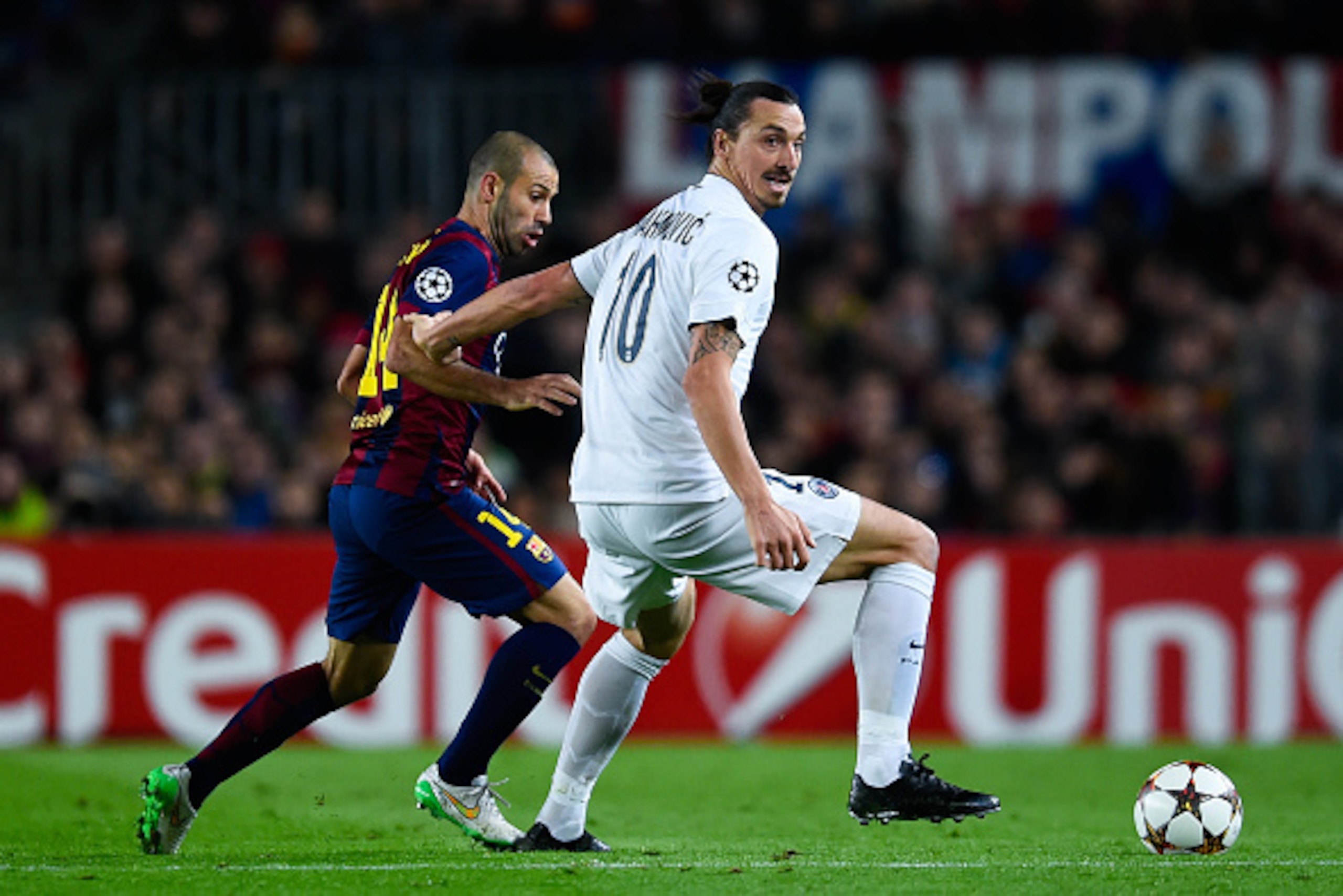 BARCELONA, SPAIN - DECEMBER 10:  Zlatan Ibraimovic of Paris Saint-Germain FC competes for the ball with Javier Mascherano of FC Barcelona during prior to the UEFA Champions League group F match between FC Barcelona and Paris Saint-Germanin FC at Camp Nou 
