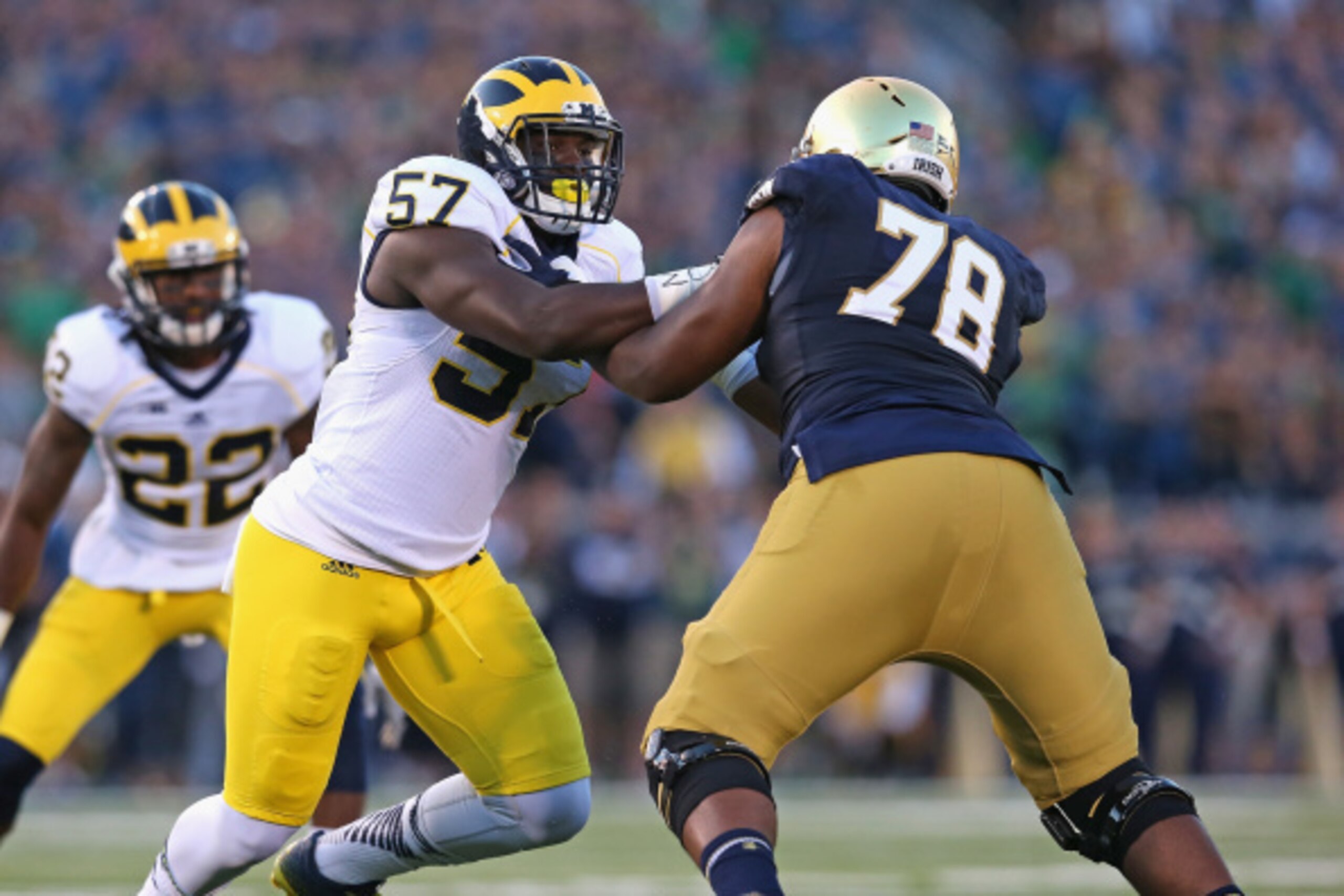 SOUTH BEND, IN - SEPTEMBER 06:  Frank Clark #57 of the Michigan Wolverines rushes against Ronnie Stanley #78 of the Notre Dame Fighting Irish at Notre Dame Stadium on September 6, 2014 in South Bend, Indiana. Notre Dame defeated Michigan 31-0.  (Photo by 