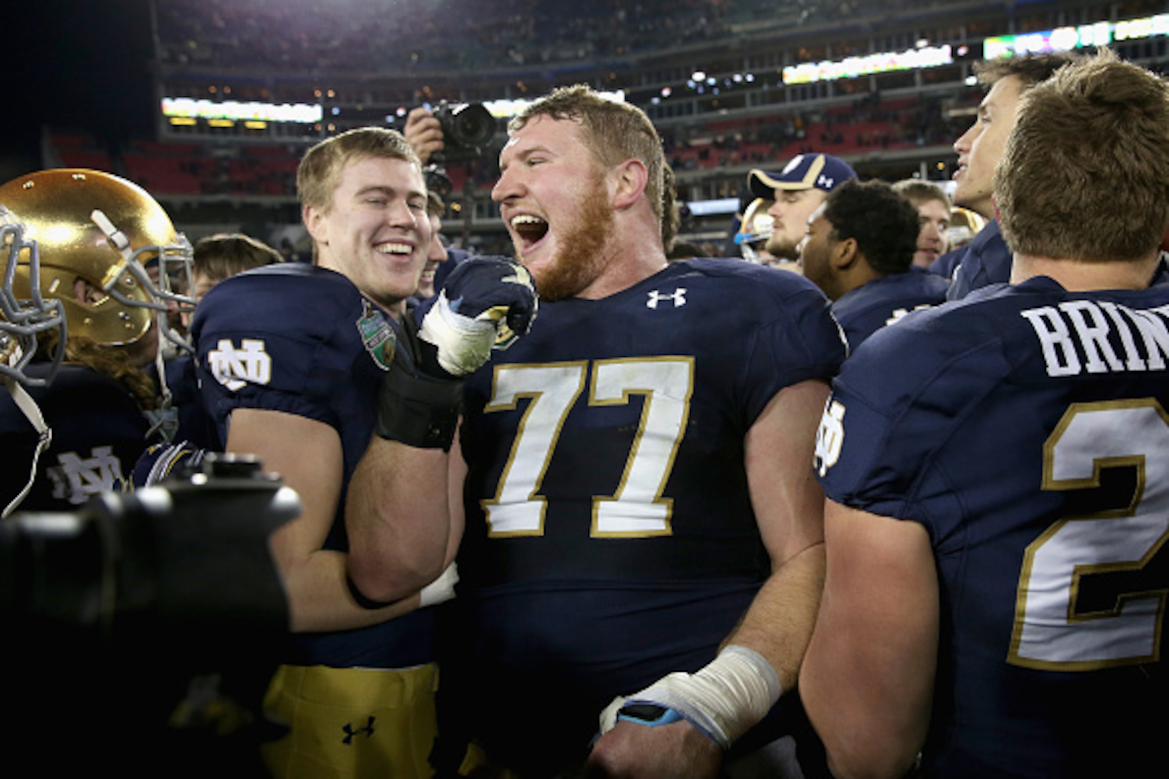 NASHVILLE, TN - DECEMBER 30:  Matt Hegarty #77 of the Notre Dame Fighting Irish celebrates after beating the LSU Tigers in the Franklin American Mortgage Music City Bowl at LP Field on December 30, 2014 in Nashville, Tennessee.  (Photo by Andy Lyons/Getty