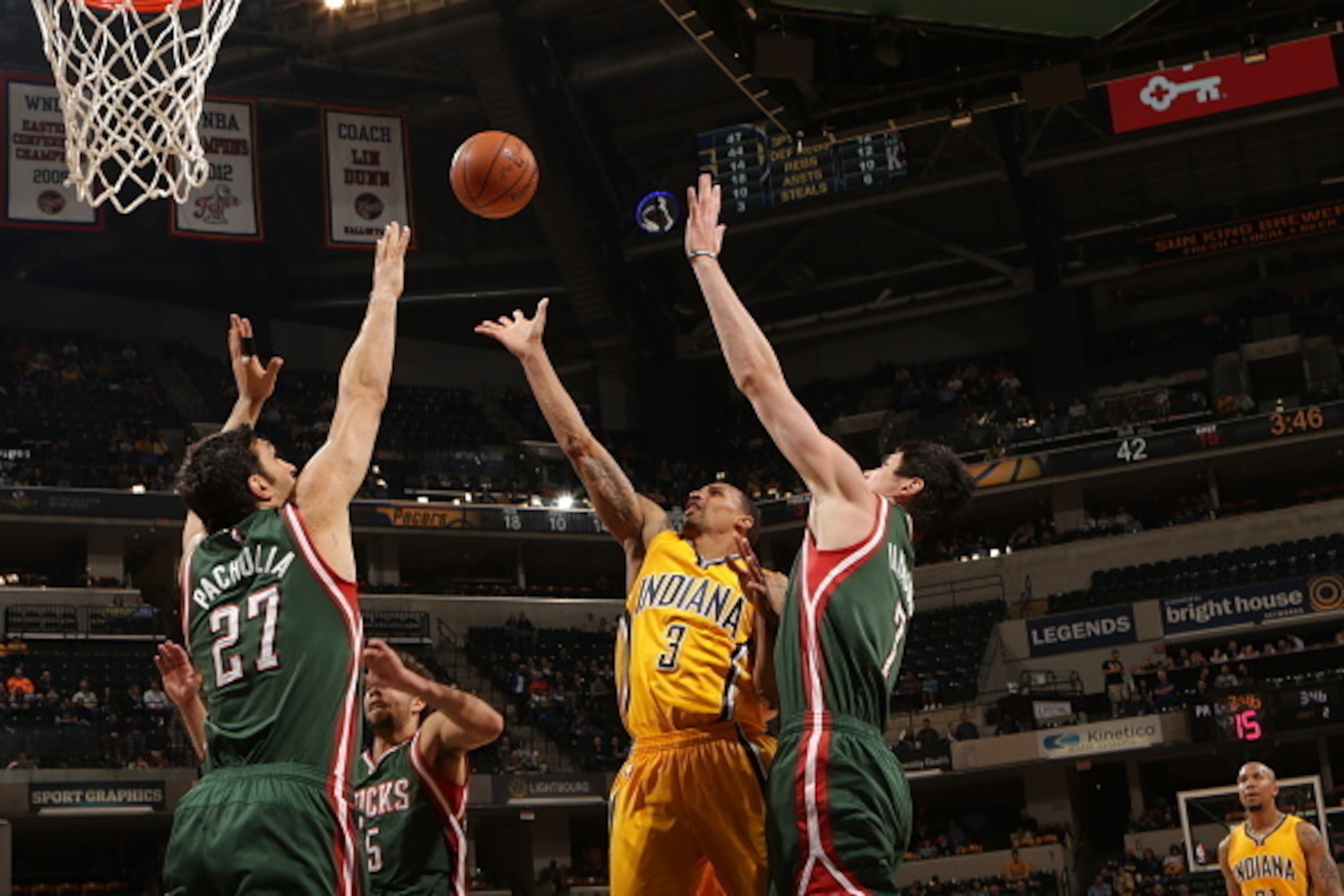INDIANAPOLIS, IN - MARCH 12:  George Hill #3 of the Indiana Pacers shoots against Zaza Pachulia #27 of the Milwaukee Bucks on March 12, 2015 at Bankers Life Fieldhouse in Indianapolis, Indiana.  NOTE TO USER: User expressly acknowledges and agrees that, b