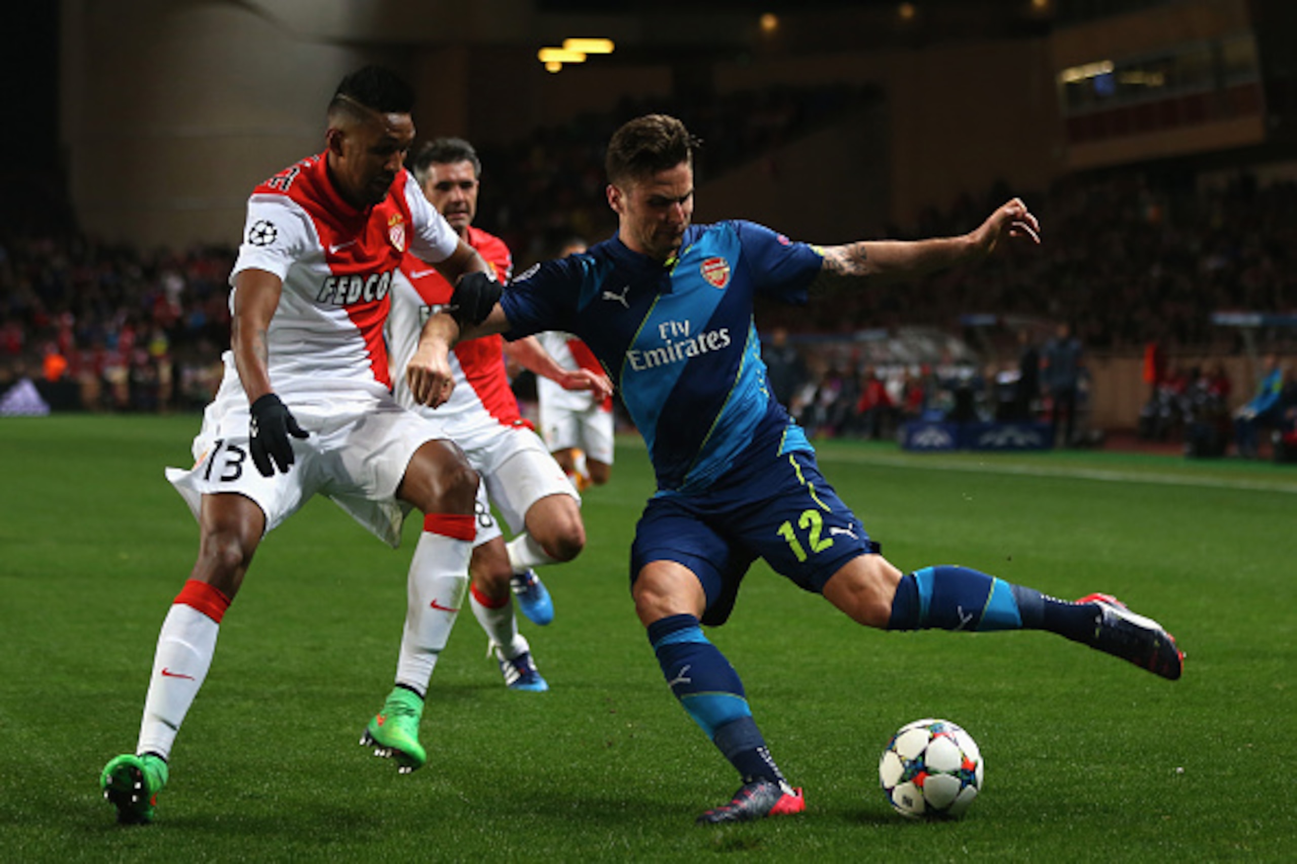 MONACO - MARCH 17: Wallace (L) of AS Monaco tracks Olivier Giroud (R) of Arsenal during the UEFA Champions League Round of Sixteen 2nd Leg match between AS Monaco and Arsenal at Stade Louis II on March 17, 2015 in Monaco, Monaco. (Photo by Michael Steel MONACO - MARCH 17: Wallace (L) of AS Monaco tracks Olivier Giroud (R) of Arsenal during the UEFA Champions League Round of Sixteen 2nd Leg match between AS Monaco and Arsenal at Stade Louis II on March 17, 2015 in Monaco, Monaco. (Photo by Michael Steel