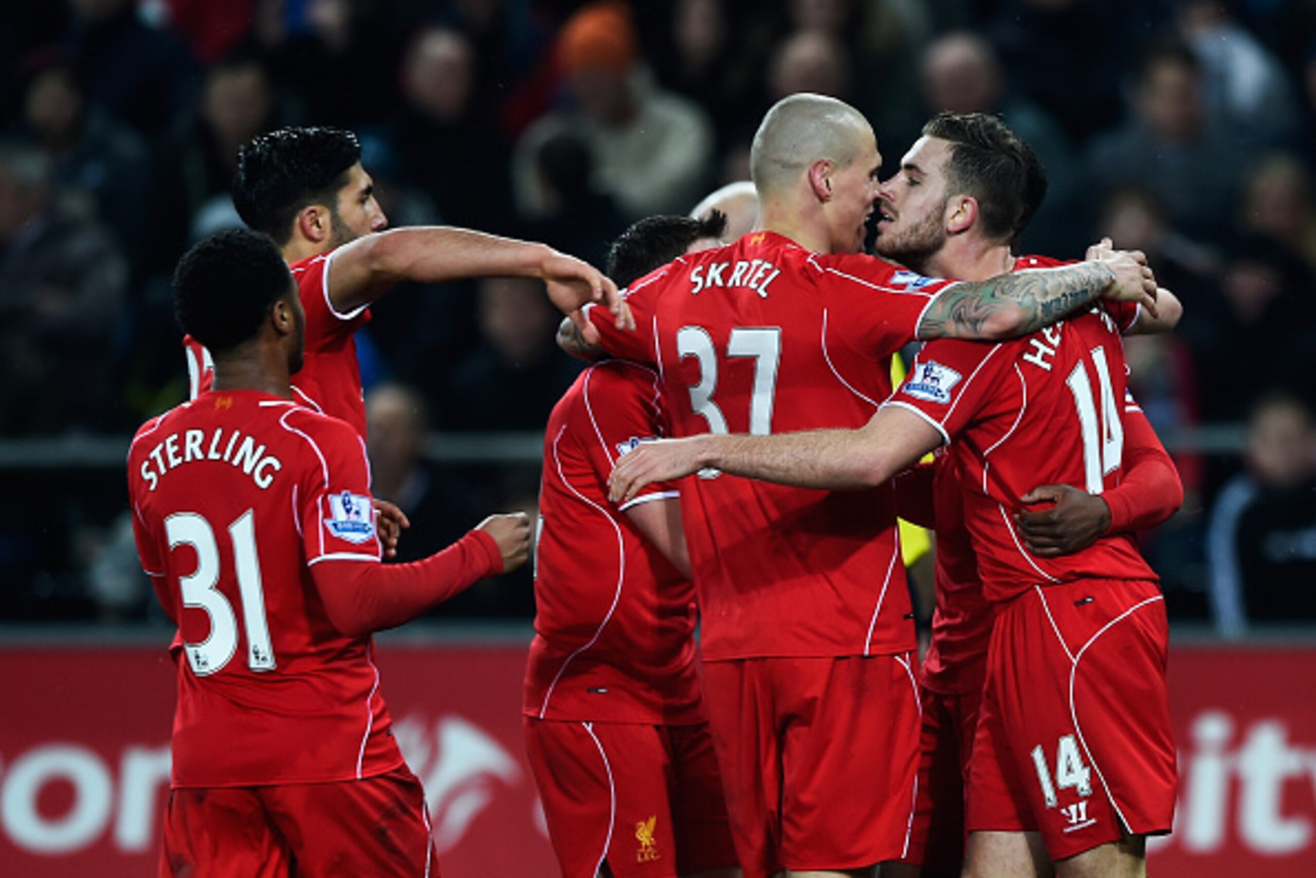 SWANSEA, WALES - MARCH 16:  Jordan Henderson of Liverpool celebrates the opening goal with team mates during the Barclays Premier League match between Swansea City and Liverpool at Liberty Stadium on March 16, 2015 in Swansea, Wales.  (Photo by Mike Hewit