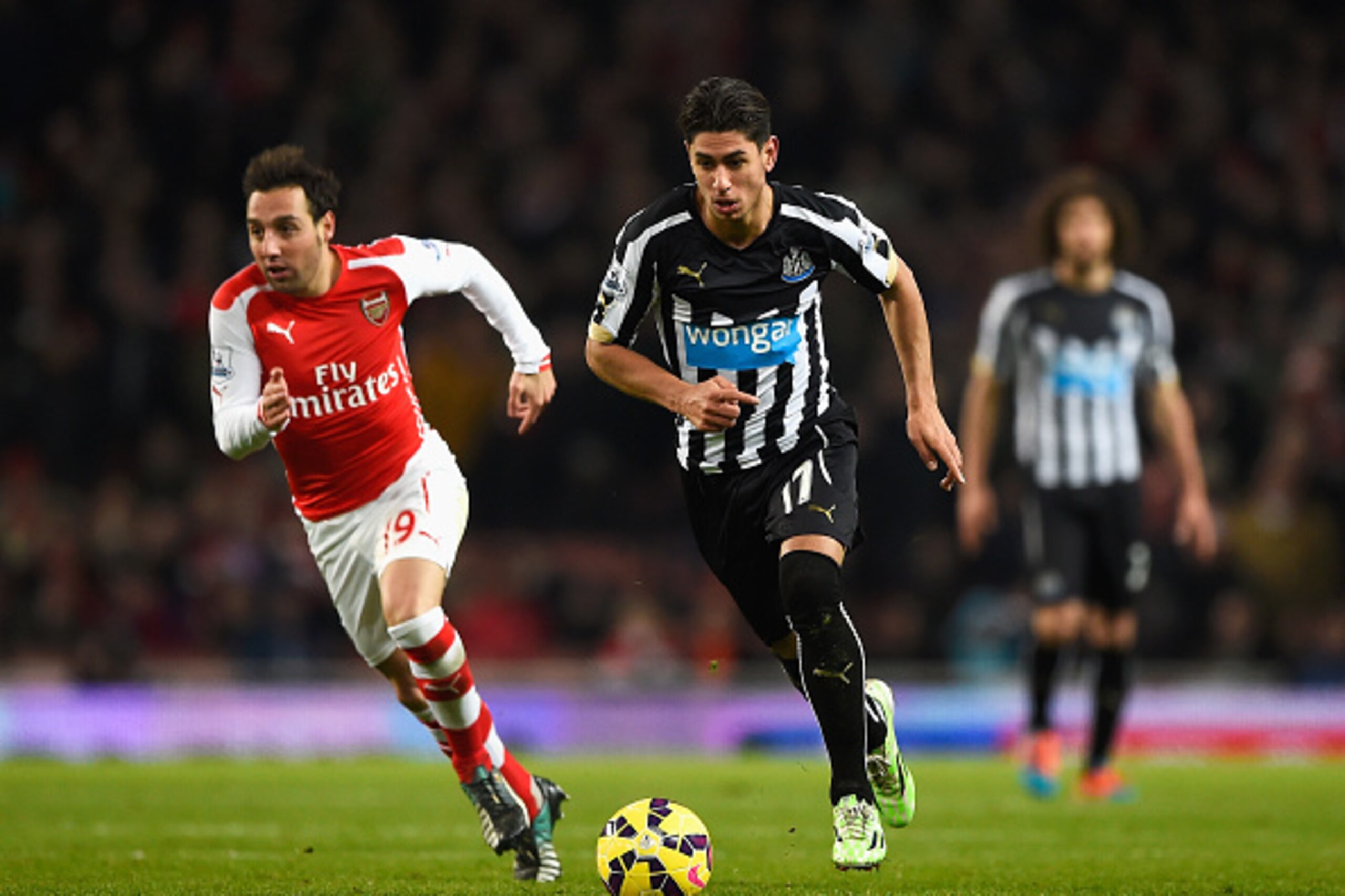 LONDON, ENGLAND - DECEMBER 13: Ayoze Perez of Newcastle United goes past Santi Cazorla of Arsenal during the Barclays Premier League match between Arsenal and Newcastle United at Emirates Stadium on December 13, 2014 in London, England. (Photo by Mike He LONDON, ENGLAND - DECEMBER 13: Ayoze Perez of Newcastle United goes past Santi Cazorla of Arsenal during the Barclays Premier League match between Arsenal and Newcastle United at Emirates Stadium on December 13, 2014 in London, England. (Photo by Mike He