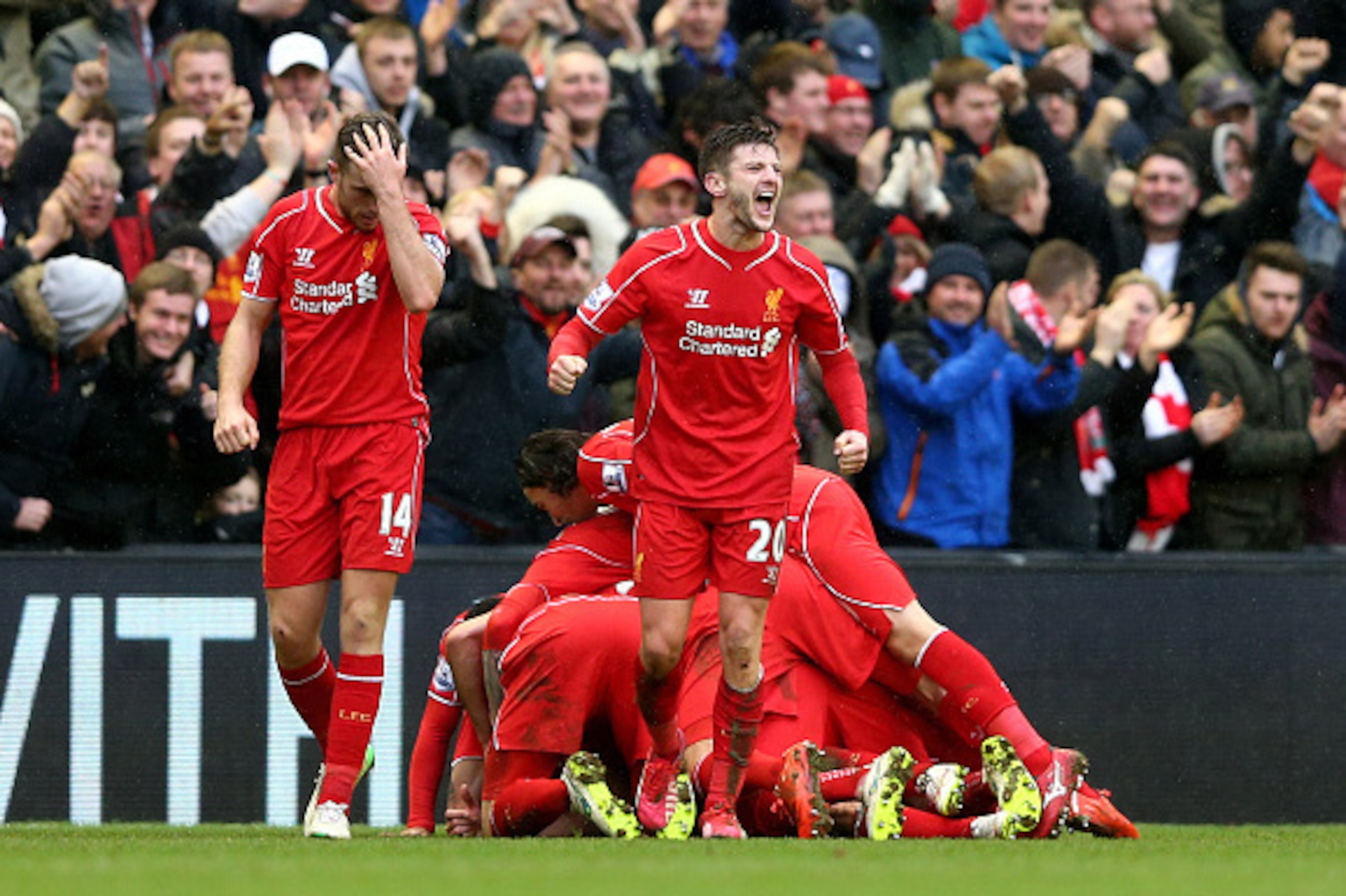 LIVERPOOL, ENGLAND - MARCH 01: Adam Lallana #20 of Liverpool celebrates after teammate Philippe Coutinho #10 of Liverpool scores team's second goal during the Barclays Premier League match between Liverpool and Manchester City at Anfield on March 1, 2015 LIVERPOOL, ENGLAND - MARCH 01: Adam Lallana #20 of Liverpool celebrates after teammate Philippe Coutinho #10 of Liverpool scores team's second goal during the Barclays Premier League match between Liverpool and Manchester City at Anfield on March 1, 2015