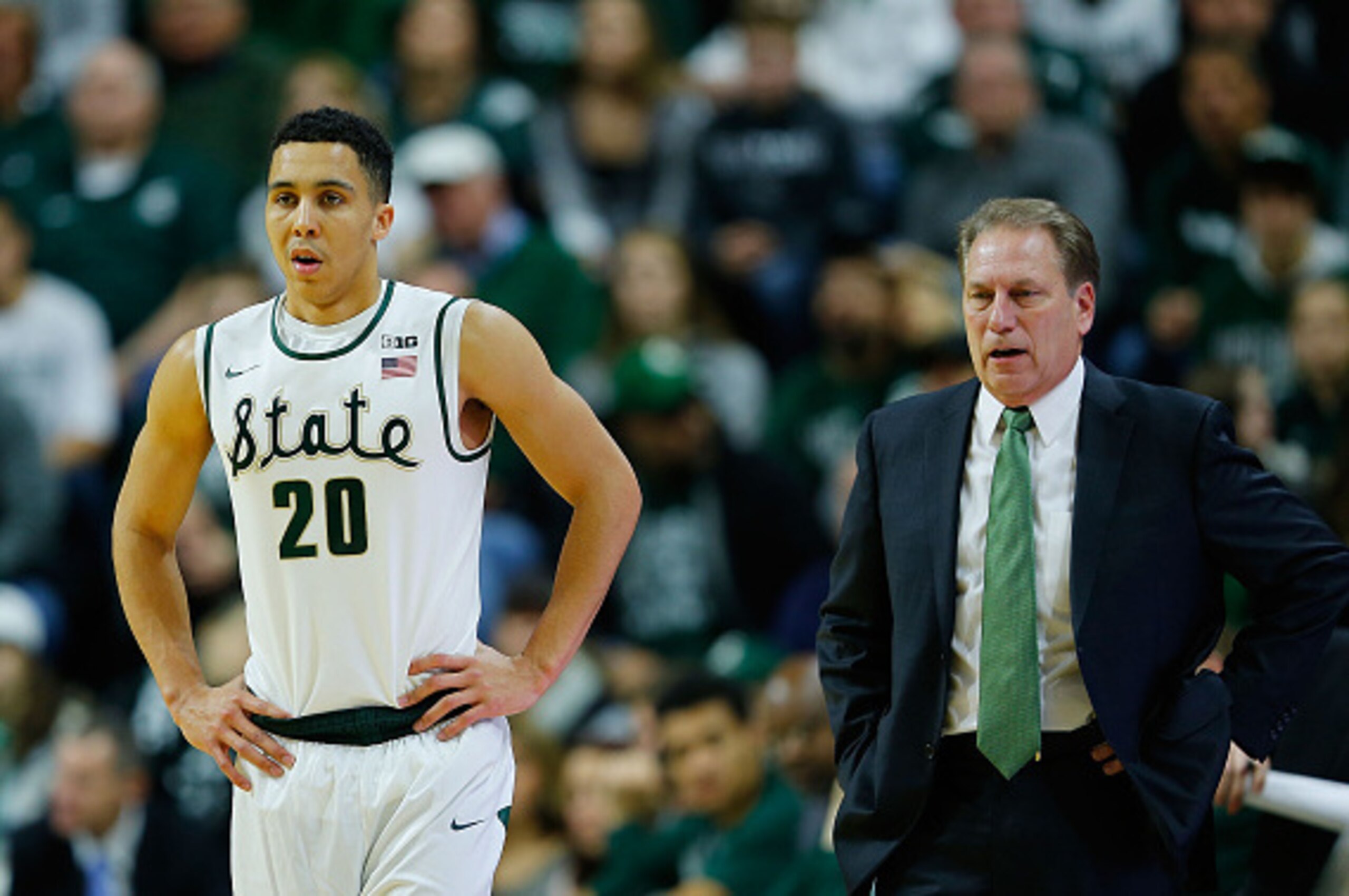EAST LANSING, MI - DECEMBER 30:  Travis Trice #20 of the Michigan State Spartans brings the ball down the court during the first half of the game against the Maryland Terrapins at Breslin Center on December 30, 2014 in East Lansing, Michigan. Maryland def