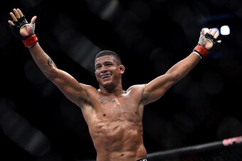 RIO DE JANEIRO, BRAZIL - OCTOBER 25:  Gilbert Burns of Brazil celebrates after his submission victory over Christos Giagos in their lightweight bout during the UFC 179 event at Maracanazinho on October 25, 2014 in Rio de Janeiro, Brazil.  (Photo by Buda M