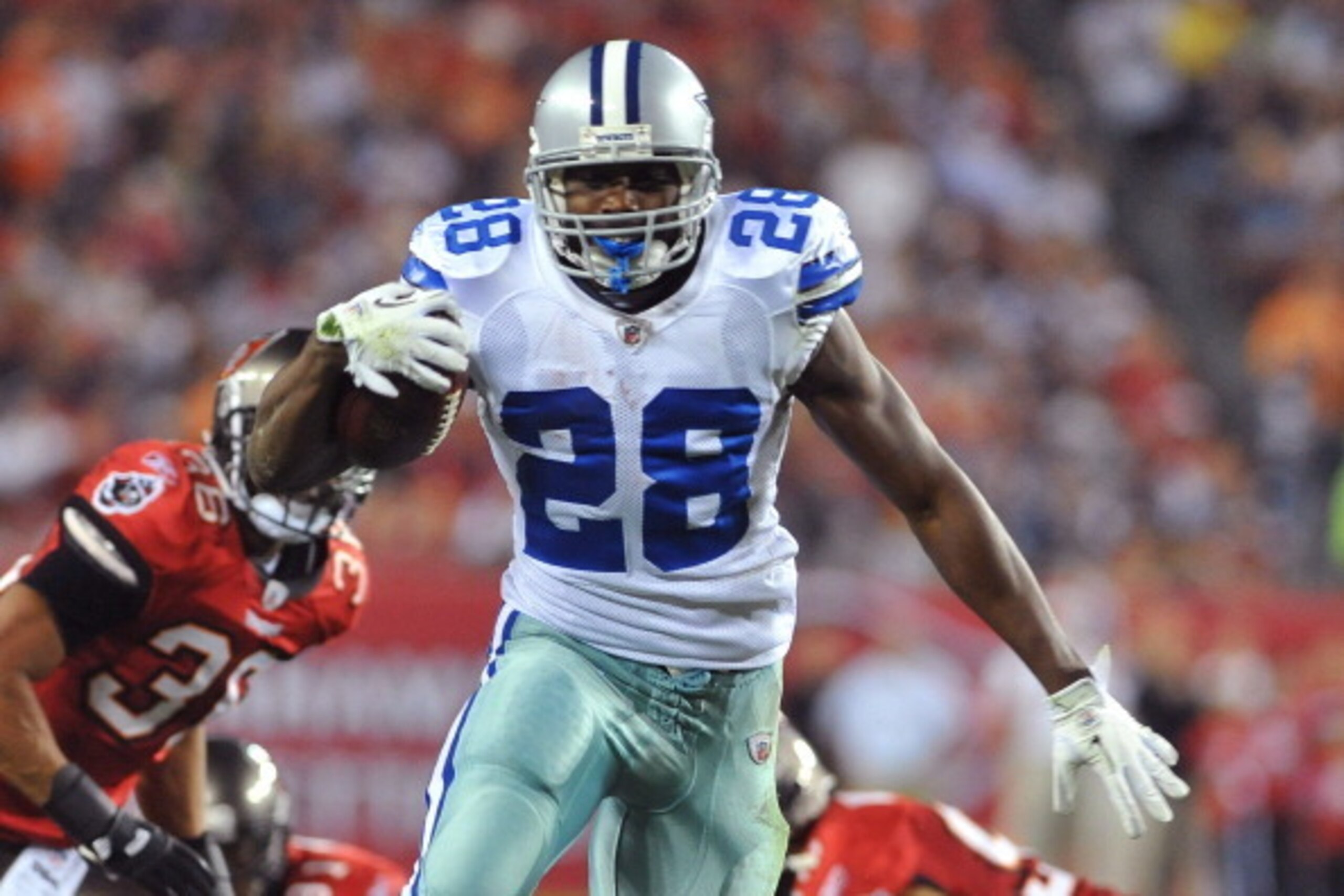 TAMPA, FL - DECEMBER 17:  Running back Felix Jones #28 of the Dallas Cowboys runs for a gain against the Tampa Bay Buccaneers December 17, 2011 at Raymond James Stadium in Tampa, Florida. (Photo by Al Messerschmidt/Getty Images)