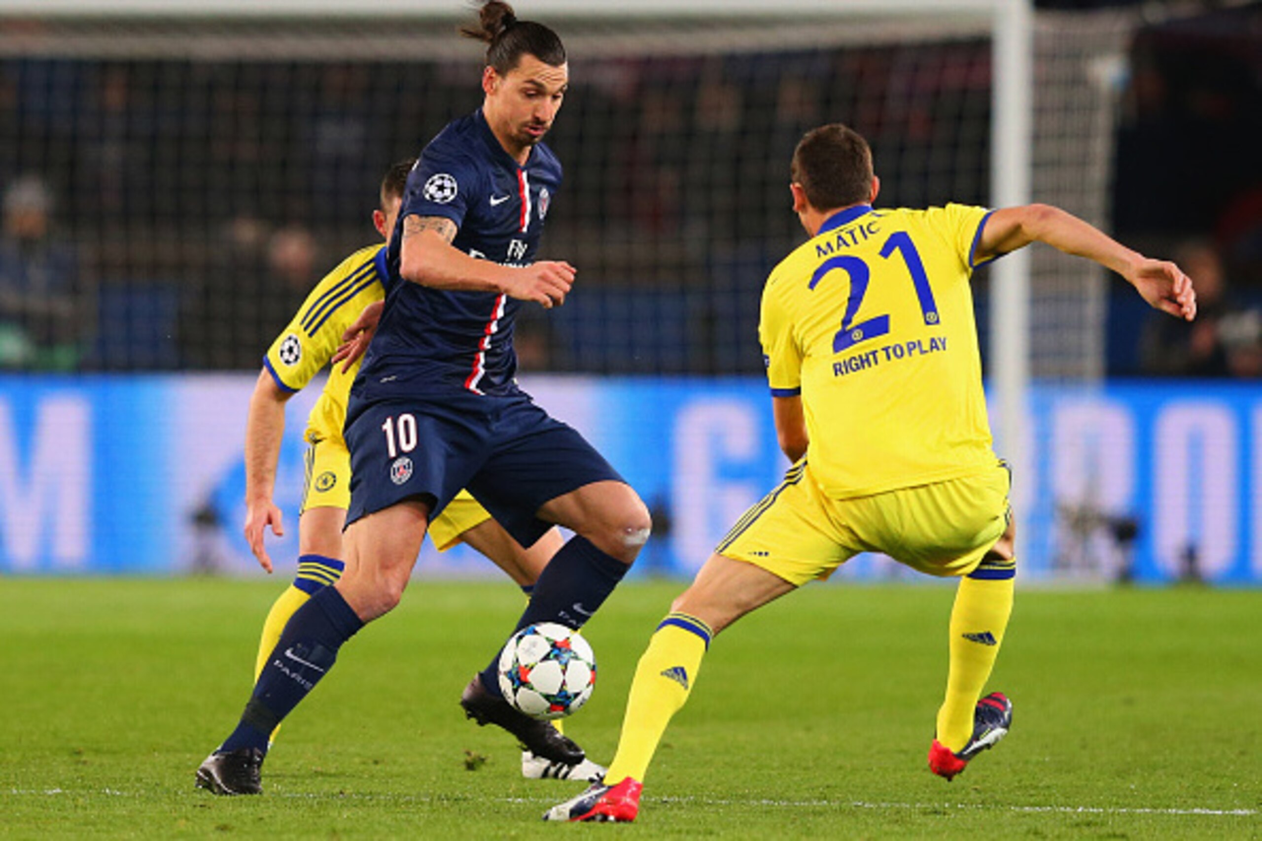 PARIS, FRANCE - FEBRUARY 17:  Zlatan Ibrahimovic of Paris Saint-Germain takes on Nemanja Matic of Chelsea during the UEFA Champions League Round of 16 match between Paris Saint-Germain and Chelsea at Parc des Princes on February 17, 2015 in Paris, France.