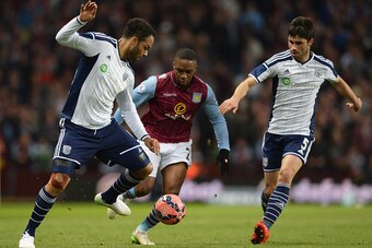 BIRMINGHAM, ENGLAND - MARCH 07:  Charles N'Zogbia of Aston Villa is foiled by Joleon Lescott (L) and Claudio Yacob of West Bromwich Albion (R) during the FA Cup Quarter Final match between Aston Villa and West Bromwich Albion at Villa Park on March 7, 201
