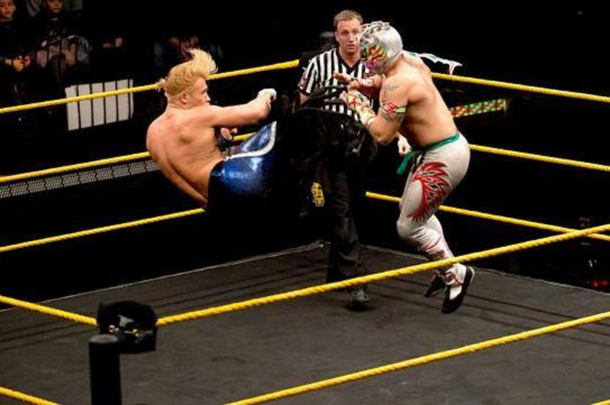 Tyler Breeze hits a dropkick on Kalisto.