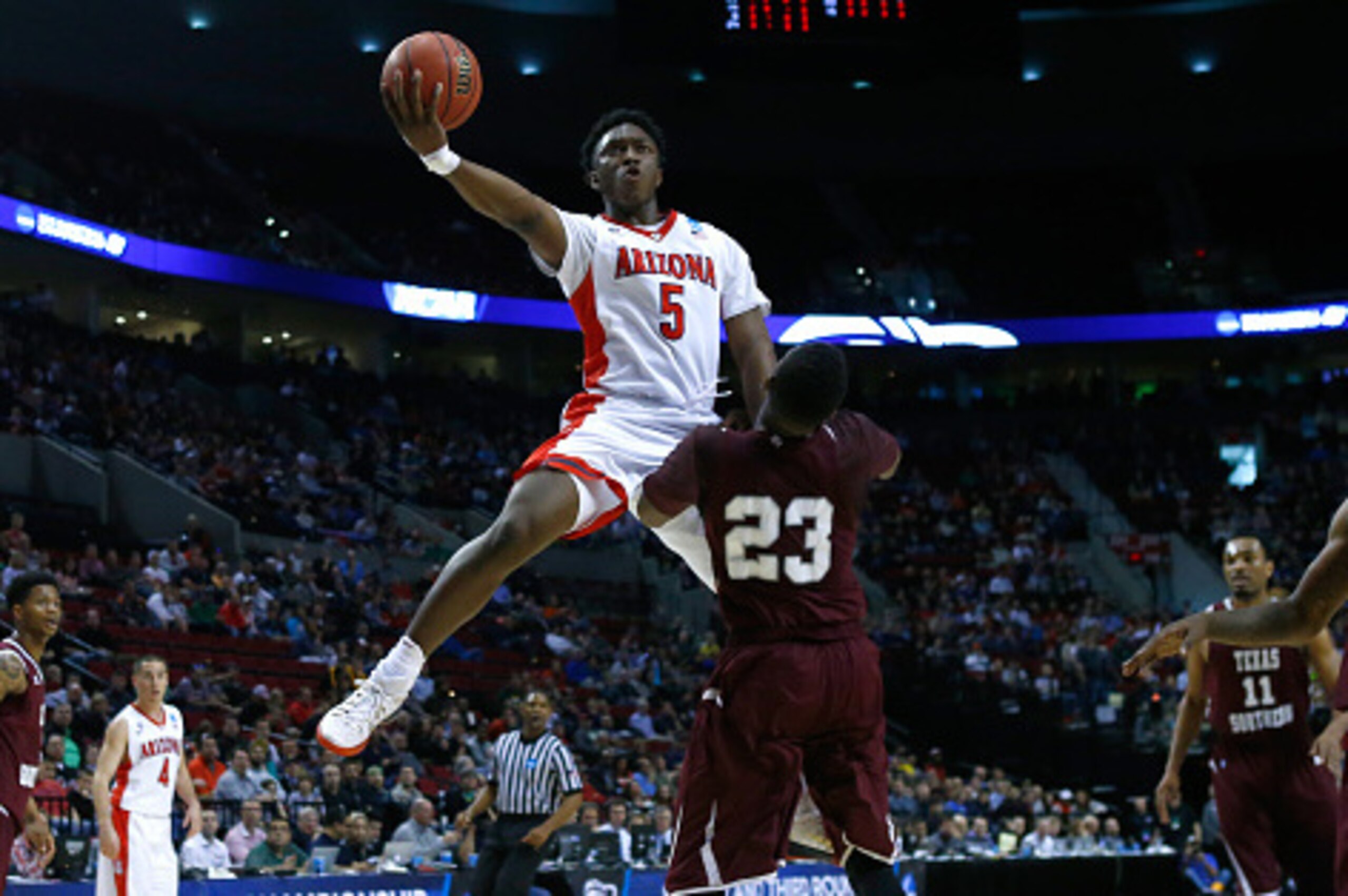 PORTLAND, OR - MARCH 19:  Stanley Johnson #5 of the Arizona Wildcats puts up a shot over Jason Carter #23 of the Texas Southern Tigers in the first half during the second round of the 2015 NCAA Men's Basketball Tournament at Moda Center on March 19, 2015 