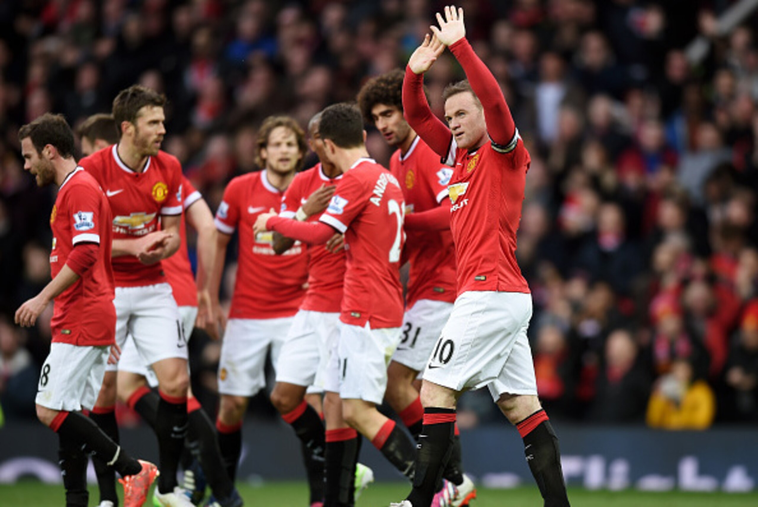 MANCHESTER, ENGLAND - MARCH 15:  Wayne Rooney of Manchester United celebrates after scoring his team's third goal during the Barclays Premier League match between Manchester United and Tottenham Hotspur at Old Trafford on March 15, 2015 in Manchester, Eng