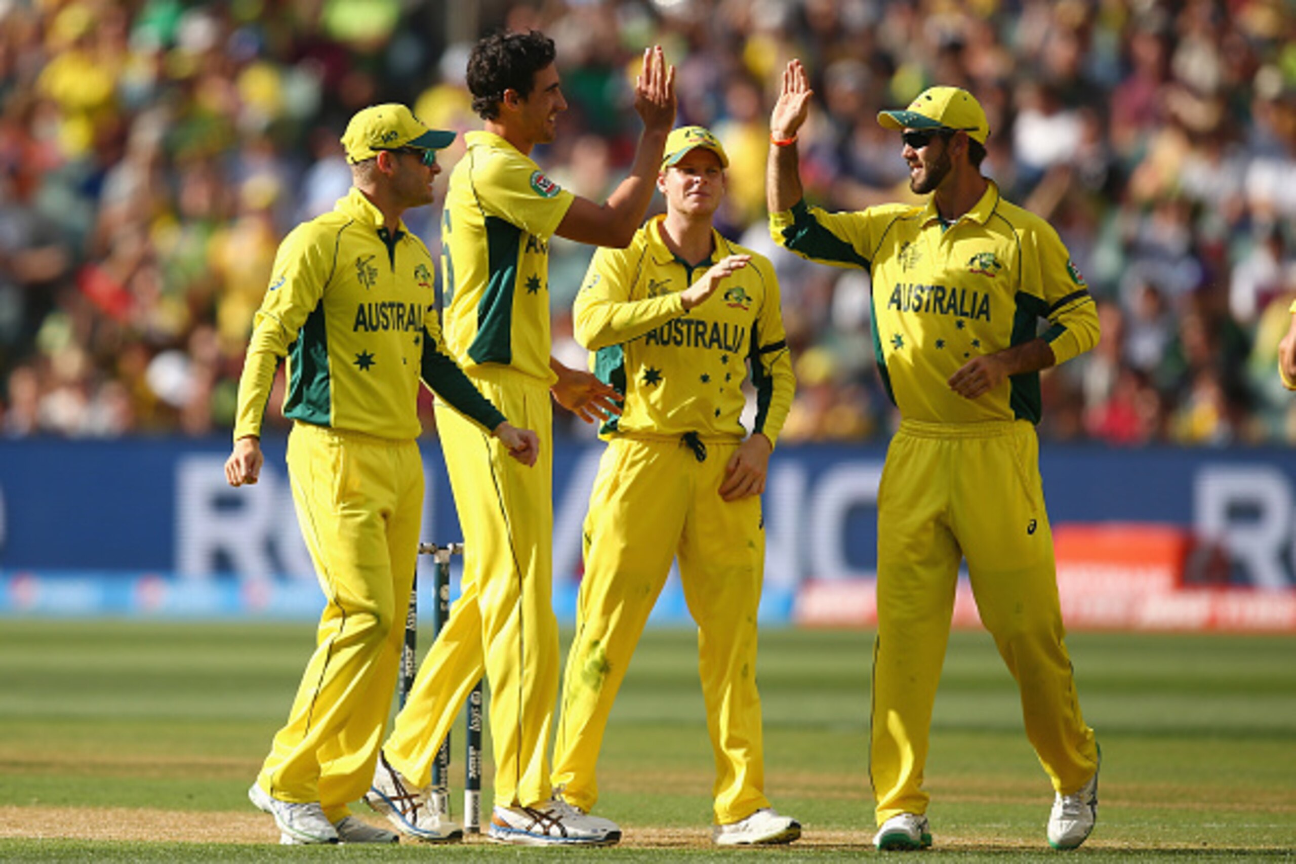 ADELAIDE, AUSTRALIA - MARCH 20:  Mitchell Starc of Australia celebrates with Glenn Maxwell of Australia and his team mates after taking the wicket of Wahab Riaz of Pakistan during the 2015 ICC Cricket World Cup match between Australian and Pakistan at Ade