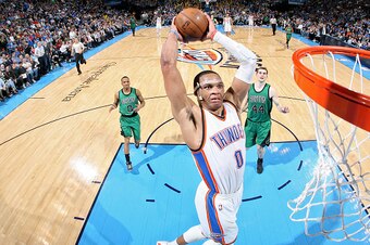 OKLAHOMA CITY, OK - MARCH 18: Russell Westbrook #0 of the Oklahoma City Thunder dunks against the Boston Celtics on March 18, 2015 at the Chesapeake Energy Arena in Oklahoma City, Oklahoma. NOTE TO USER: User expressly acknowledges and agrees that, by dow