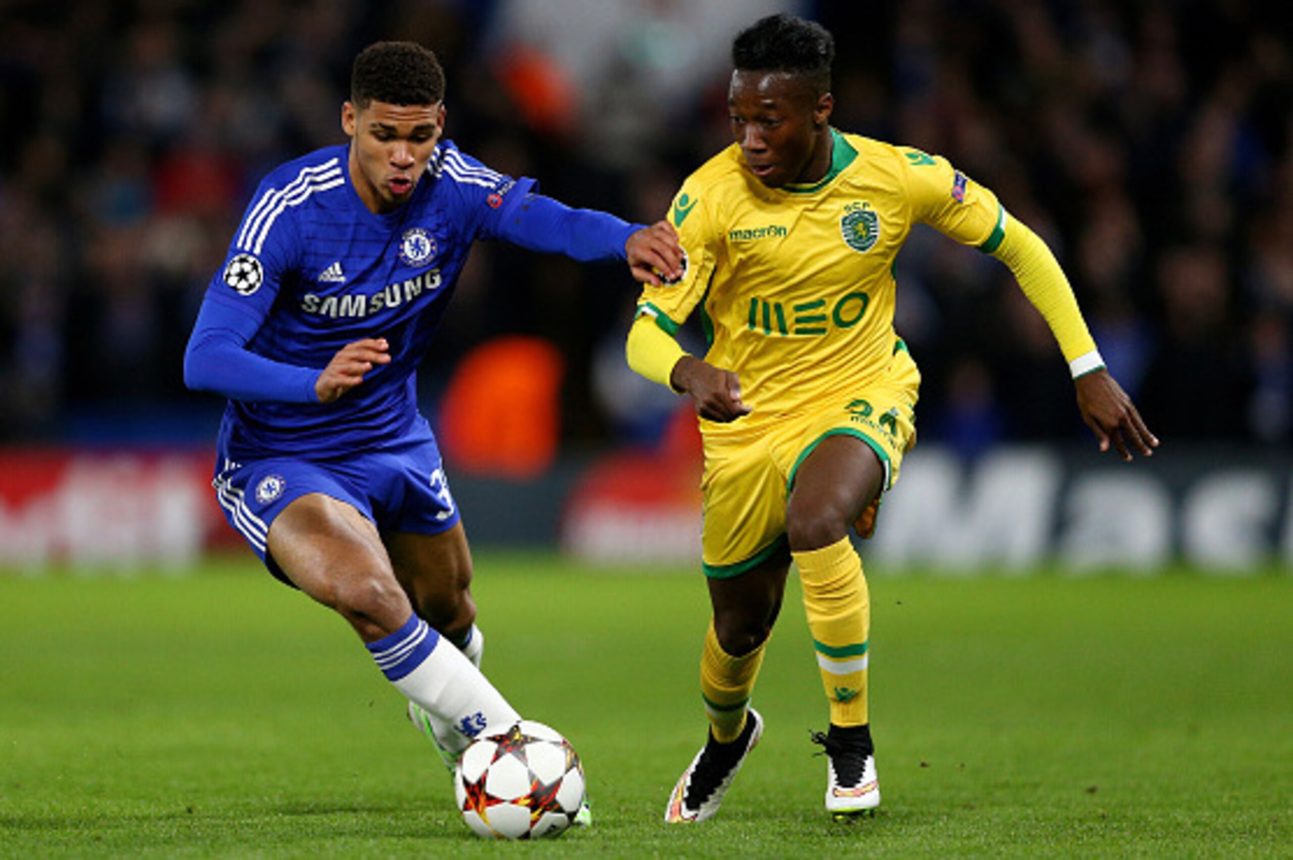 LONDON, ENGLAND - DECEMBER 10:  Carlos Mane of Sporting Lisbon is challenged by Ruben Loftus-Cheek of Chelsea during the UEFA Champions League group G match between Chelsea and Sporting Clube de Portugal at Stamford Bridge on December 10, 2014 in London, 