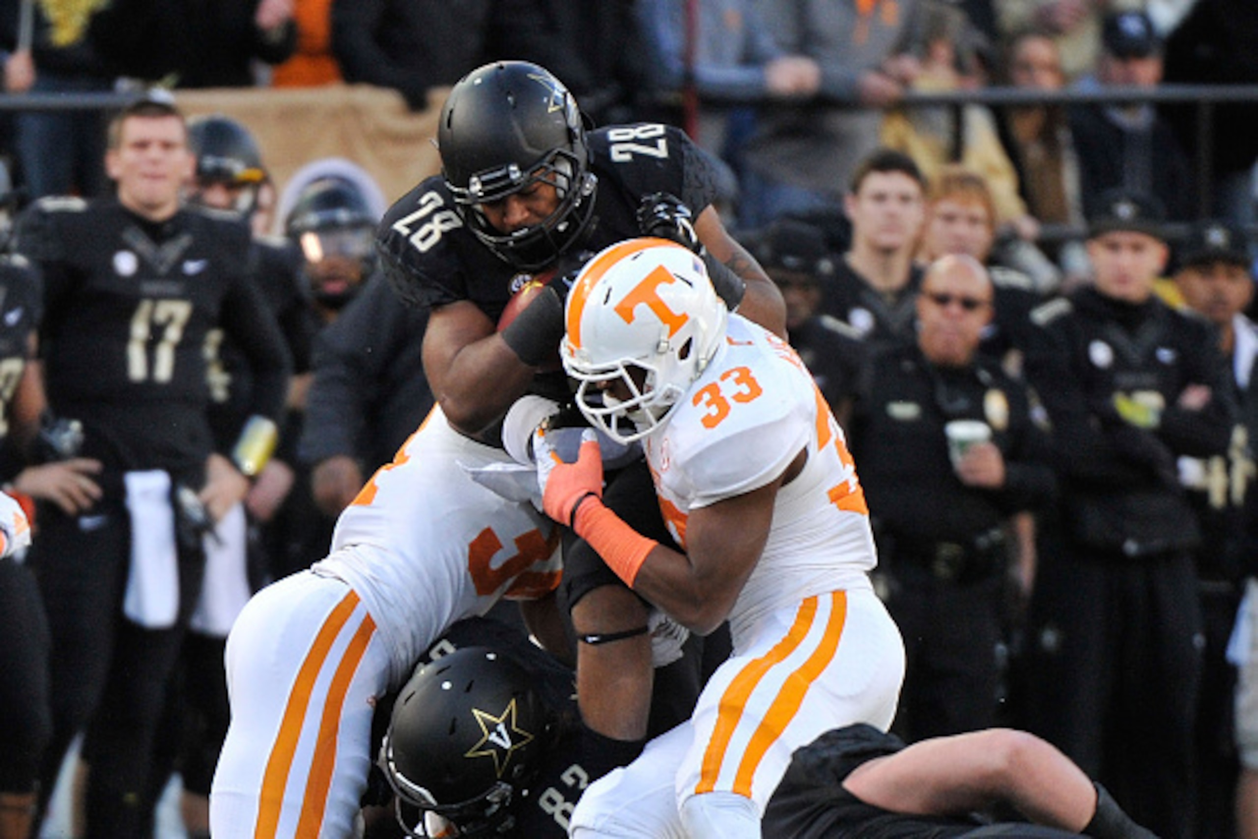 NASHVILLE, TN - NOVEMBER 29: LaDarrell McNeil #33 of the Tennessee Volunteers tackles Dallas Rivers #28 of the Vanderbilt Commodores during the first half of a game at Vanderbilt Stadium on November 29, 2014 in Nashville, Tennessee. (Photo by Frederick NASHVILLE, TN - NOVEMBER 29: LaDarrell McNeil #33 of the Tennessee Volunteers tackles Dallas Rivers #28 of the Vanderbilt Commodores during the first half of a game at Vanderbilt Stadium on November 29, 2014 in Nashville, Tennessee. (Photo by Frederick