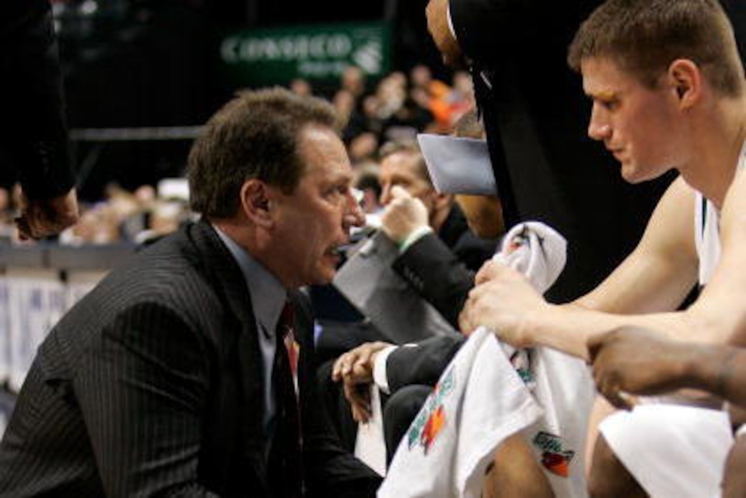 INDIANAPOLIS - MARCH 09:  Head coach Tom Izzo of the Michigan State Spartans talks with Paul Davis #40 during NCAA action against the Purdue Boilermakers on Day 1 of the Big 10 Tournament March 9, 2006 at Conseco Fieldhouse in Indianapolis, Indiana. The S