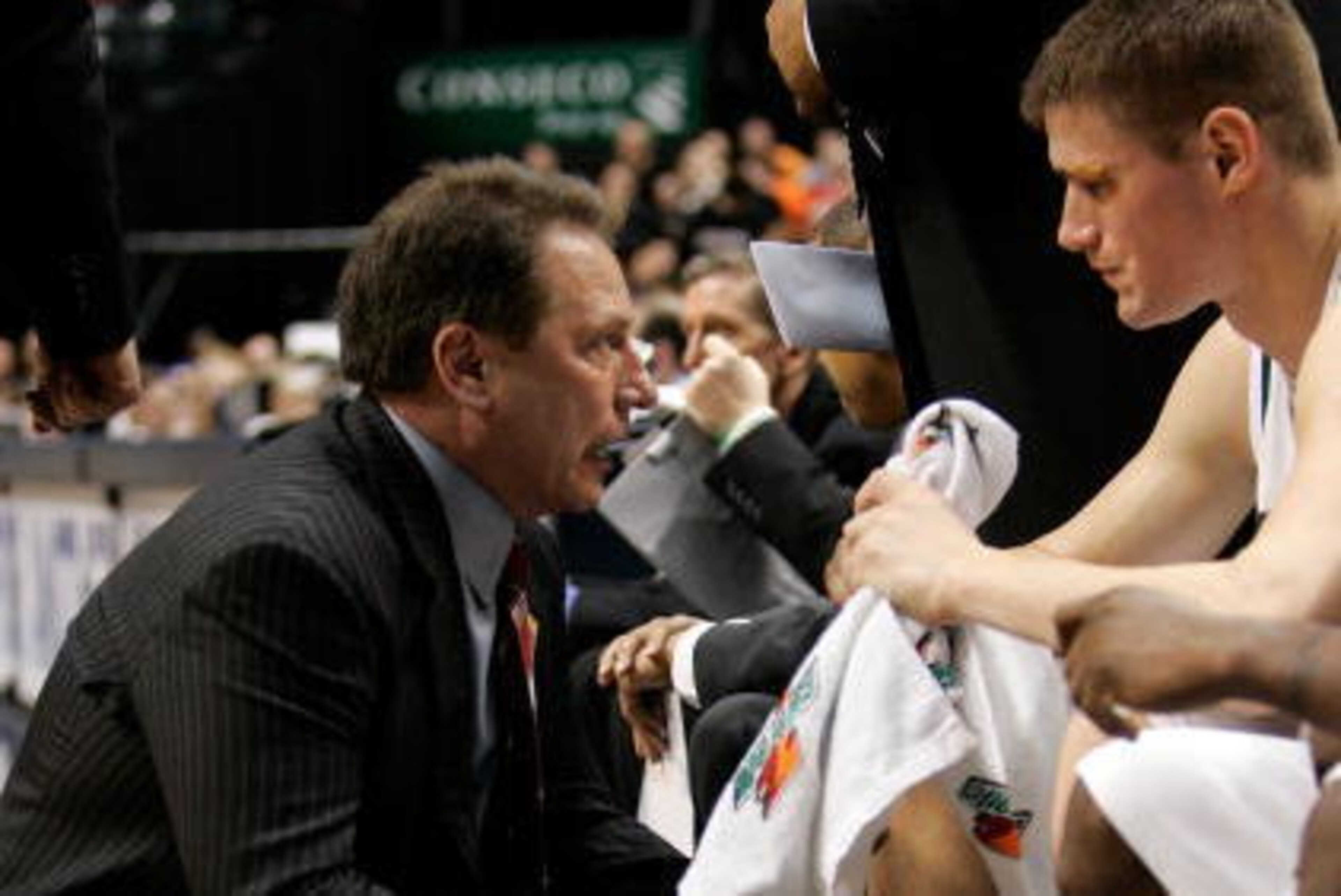 INDIANAPOLIS - MARCH 09:  Head coach Tom Izzo of the Michigan State Spartans talks with Paul Davis #40 during NCAA action against the Purdue Boilermakers on Day 1 of the Big 10 Tournament March 9, 2006 at Conseco Fieldhouse in Indianapolis, Indiana. The S