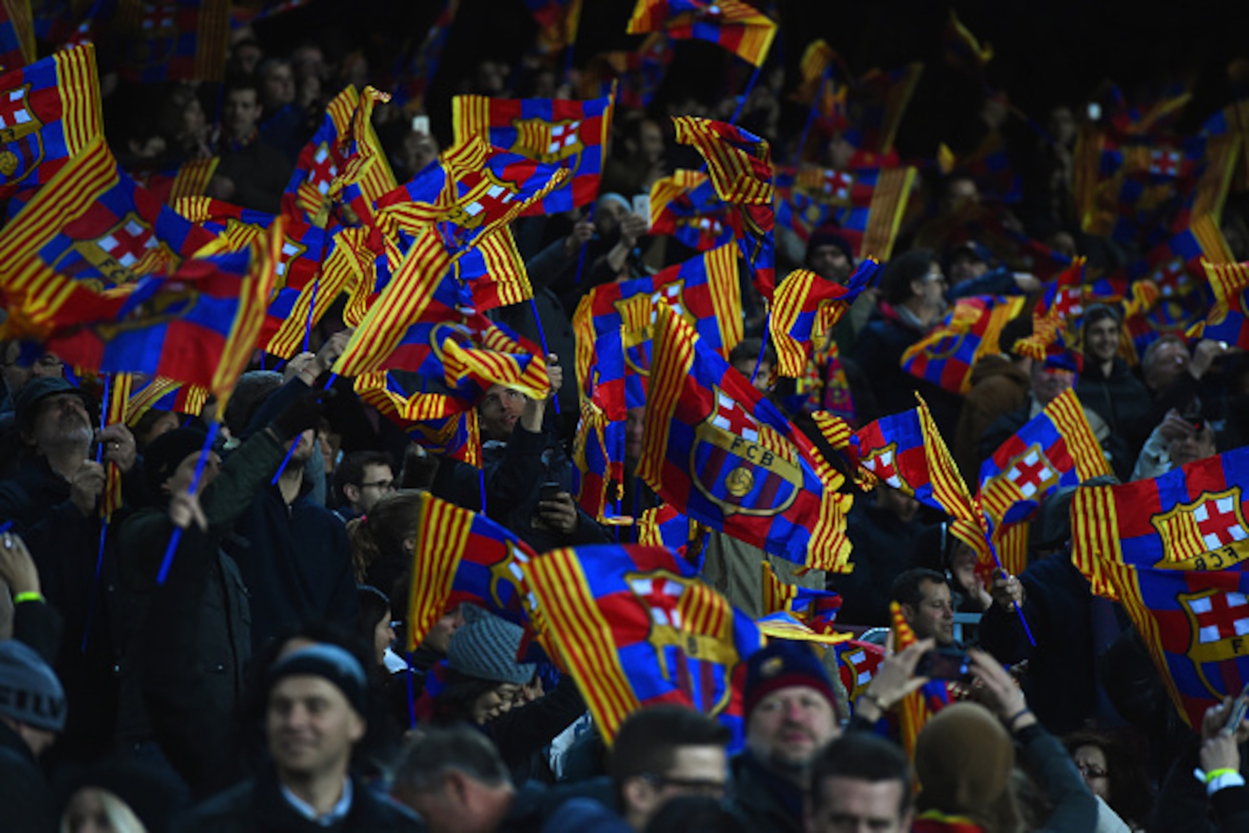 BARCELONA, SPAIN - MARCH 18: Barcelona fans wave flags during the UEFA Champions League Round of 16 second leg match between Barcelona and Manchester City at Camp Nou on March 18, 2015 in Barcelona, Spain.  (Photo by David Ramos/Getty Images)
