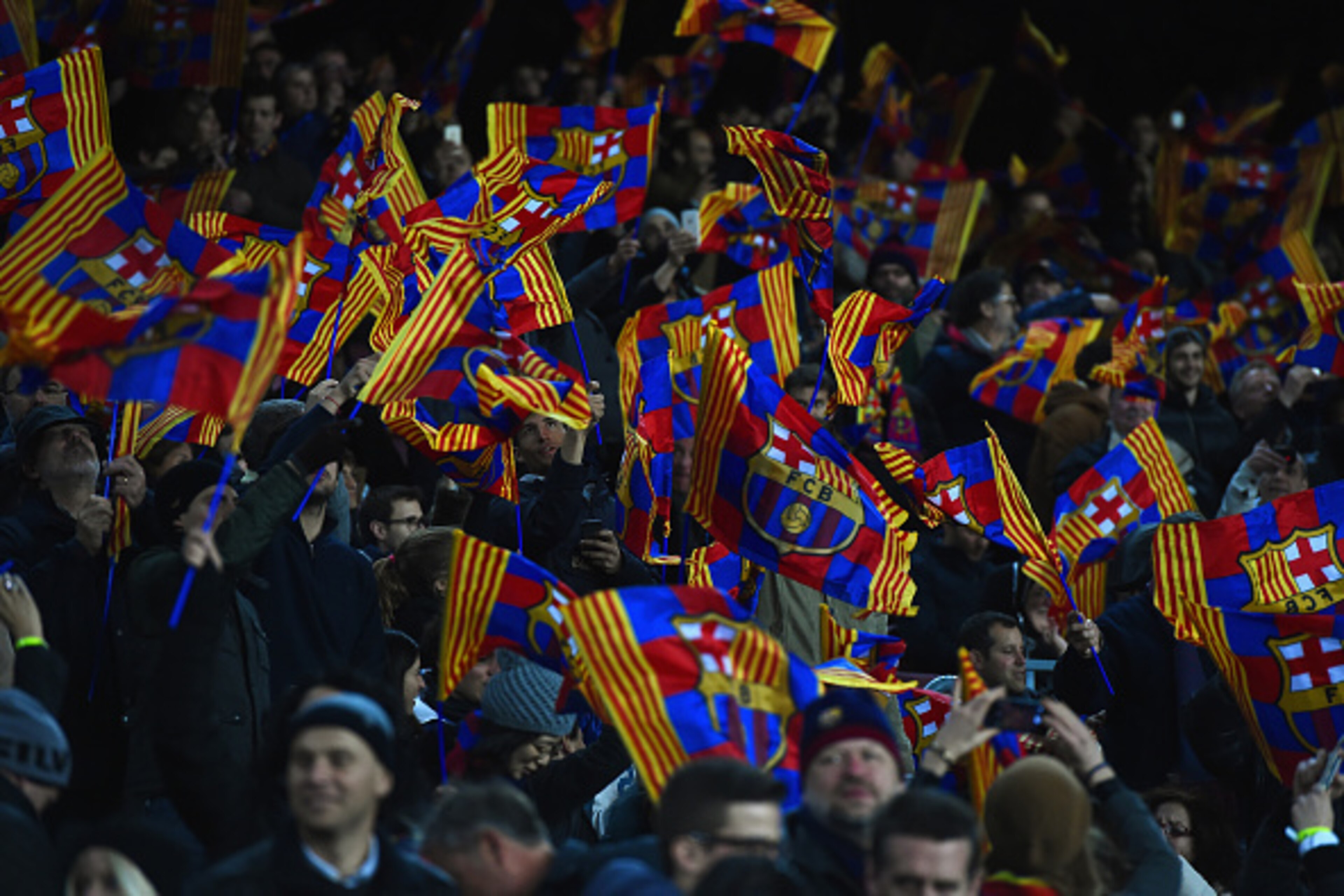 BARCELONA, SPAIN - MARCH 18: Barcelona fans wave flags during the UEFA Champions League Round of 16 second leg match between Barcelona and Manchester City at Camp Nou on March 18, 2015 in Barcelona, Spain.  (Photo by David Ramos/Getty Images)