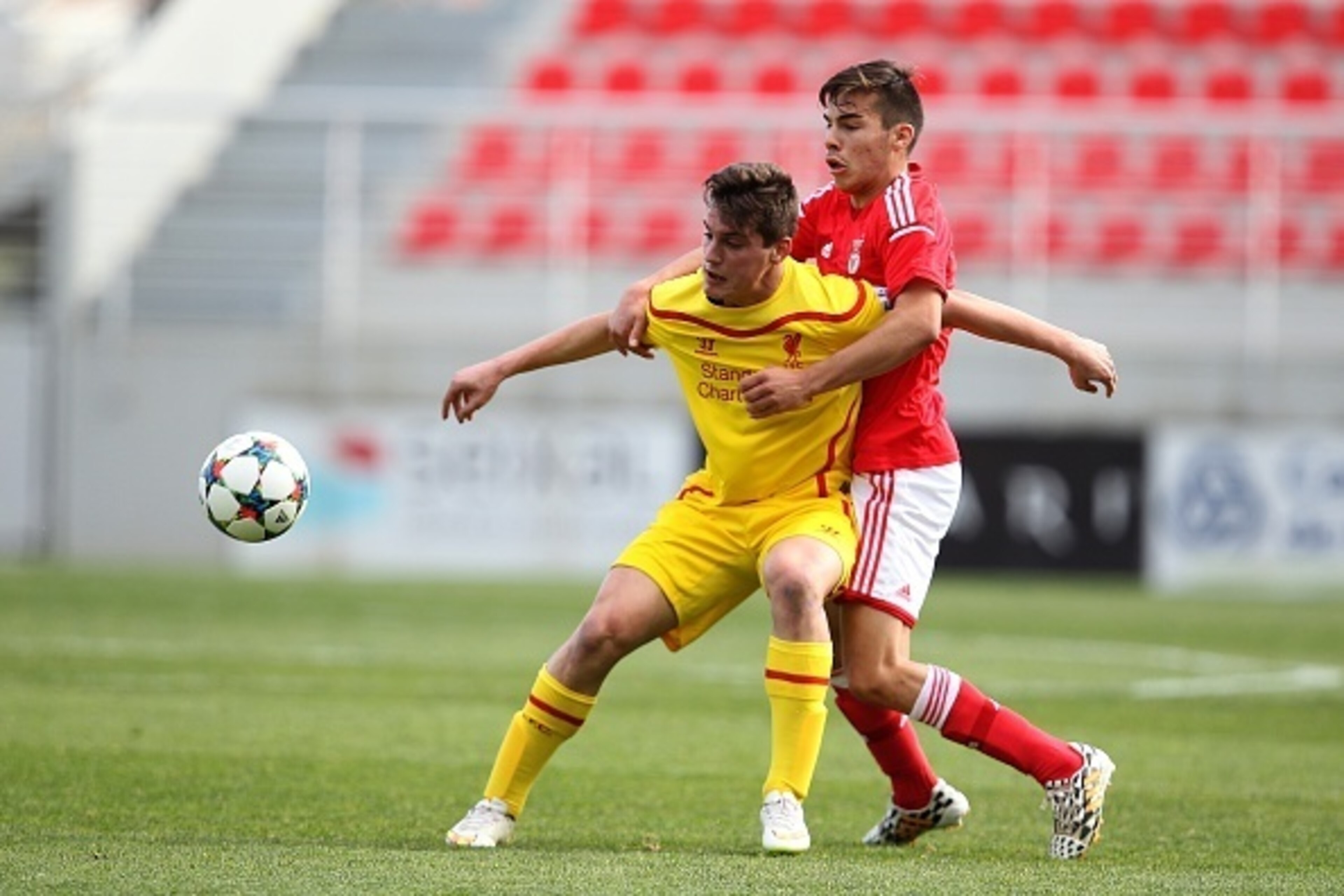 SEIXAL, PORTUGAL - FEBRUARY 24:  Benfica's defender Yuri Ribeiro and Liverpool's forward Sergi Canos in action during the UEFA Youth League match between SL Benfica and Liverpool FC on February 24, 2015 in Seixal, Portugal.  (Photo by Carlos Rodrigues/Get