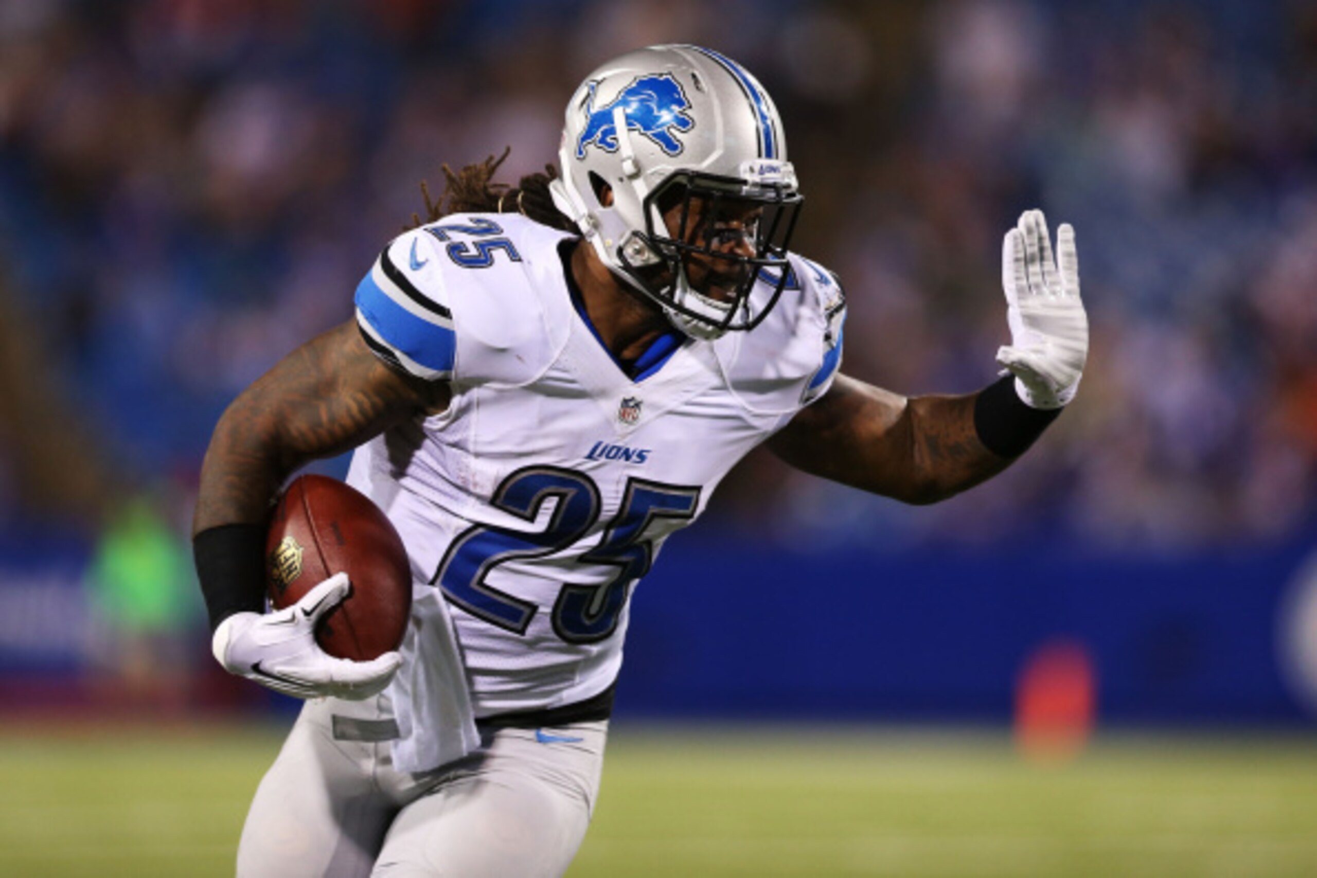ORCHARD PARK, NY - AUGUST 28:  Mikel Leshoure #25 of the Detroit Lions runs to the outside during the second half of a preseason game against the Buffalo Bills at Ralph Wilson Stadium on August 28, 2014 in Orchard Park, New York.  (Photo by Vaughn Ridley/