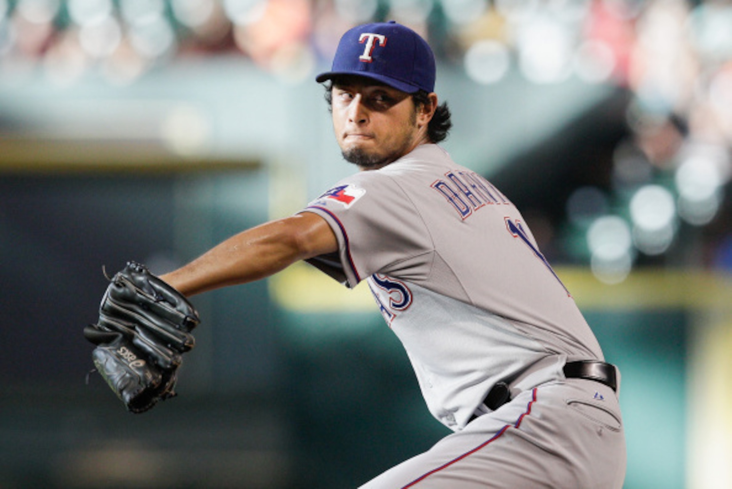 HOUSTON, TX - AUGUST 09:  Yu Darvish #11 of the Texas Rangers throws in the first inning against the Houston Astros at Minute Maid Park on August 9, 2014 in Houston, Texas.  (Photo by Bob Levey/Getty Images)