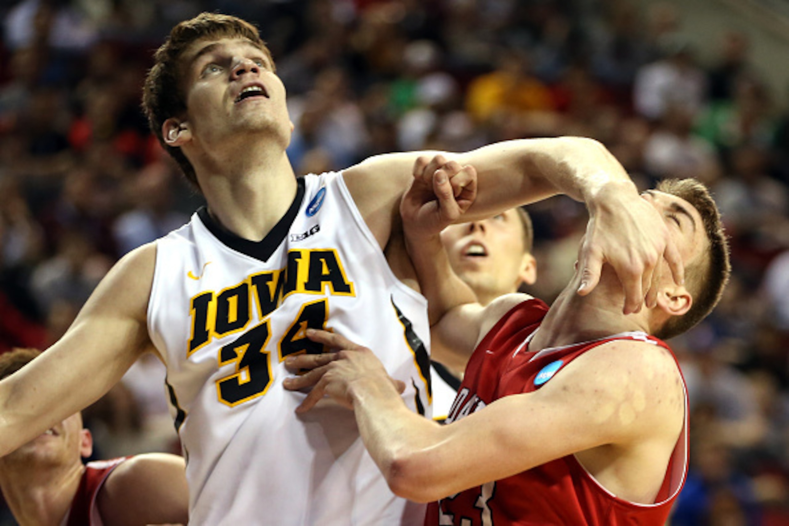 SEATTLE, WA - MARCH 20:  Adam Woodbury #34 of the Iowa Hawkeyes looks for the ball in the first half of the game against Peyton Aldridge #23 of the Davidson Wildcats during the second round of the 2015 NCAA Men's Basketball Tournament at KeyArena on March