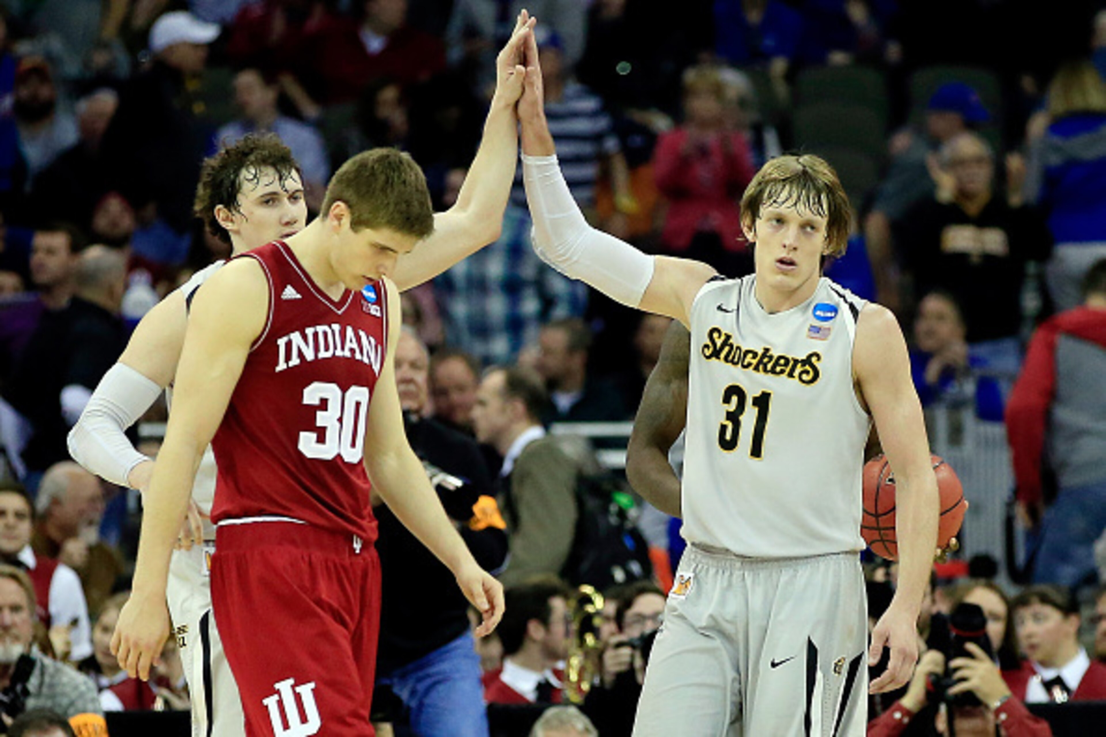 OMAHA, NE - MARCH 20:  Ron Baker #31 and Evan Wessel #3 of the Wichita State Shockers celebrate after defeating the Indiana Hoosiers 81-76 during the second round of the 2015 NCAA Men's Basketball Tournament at the CenturyLink Center on March 20, 2015 in 