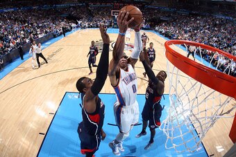 OKLAHOMA CITY, OK- March 20: Russell Westbrook #0 of the Oklahoma City Thunder dunks against the Atlanta Hawks on March 20, 2015 at Chesapeake Energy Arena in Oklahoma City, Oklahoma. NOTE TO USER: User expressly acknowledges and agrees that, by downloadi