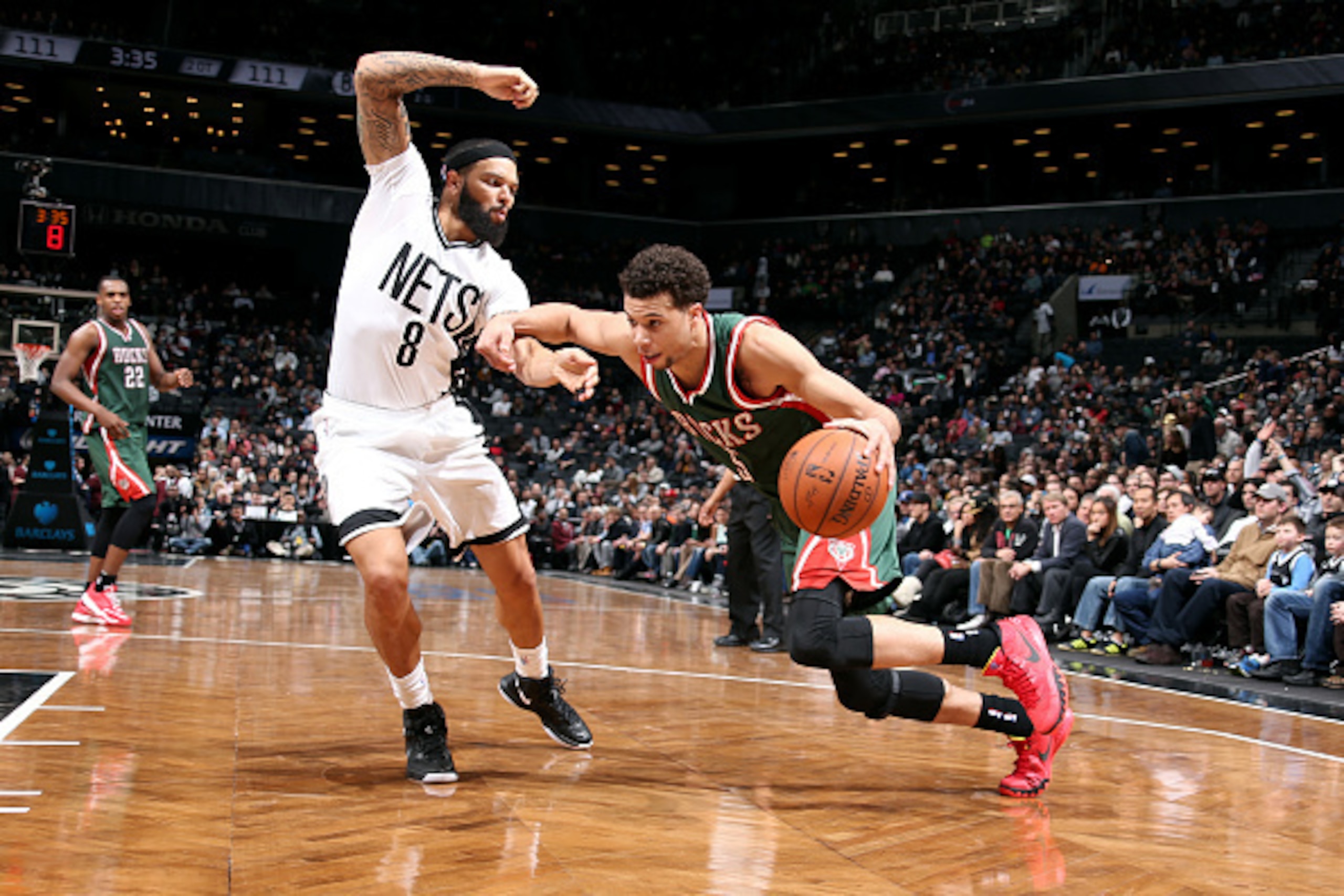 BROOKLYN, NY - MARCH 20: Michael Carter-Williams #5 of the Milwaukee Bucks drives against Deron Williams #8 of the Brooklyn Nets on March 20, 2015 at Barclays Center in Brooklyn, New York. NOTE TO USER: User expressly acknowledges and agrees that, by down