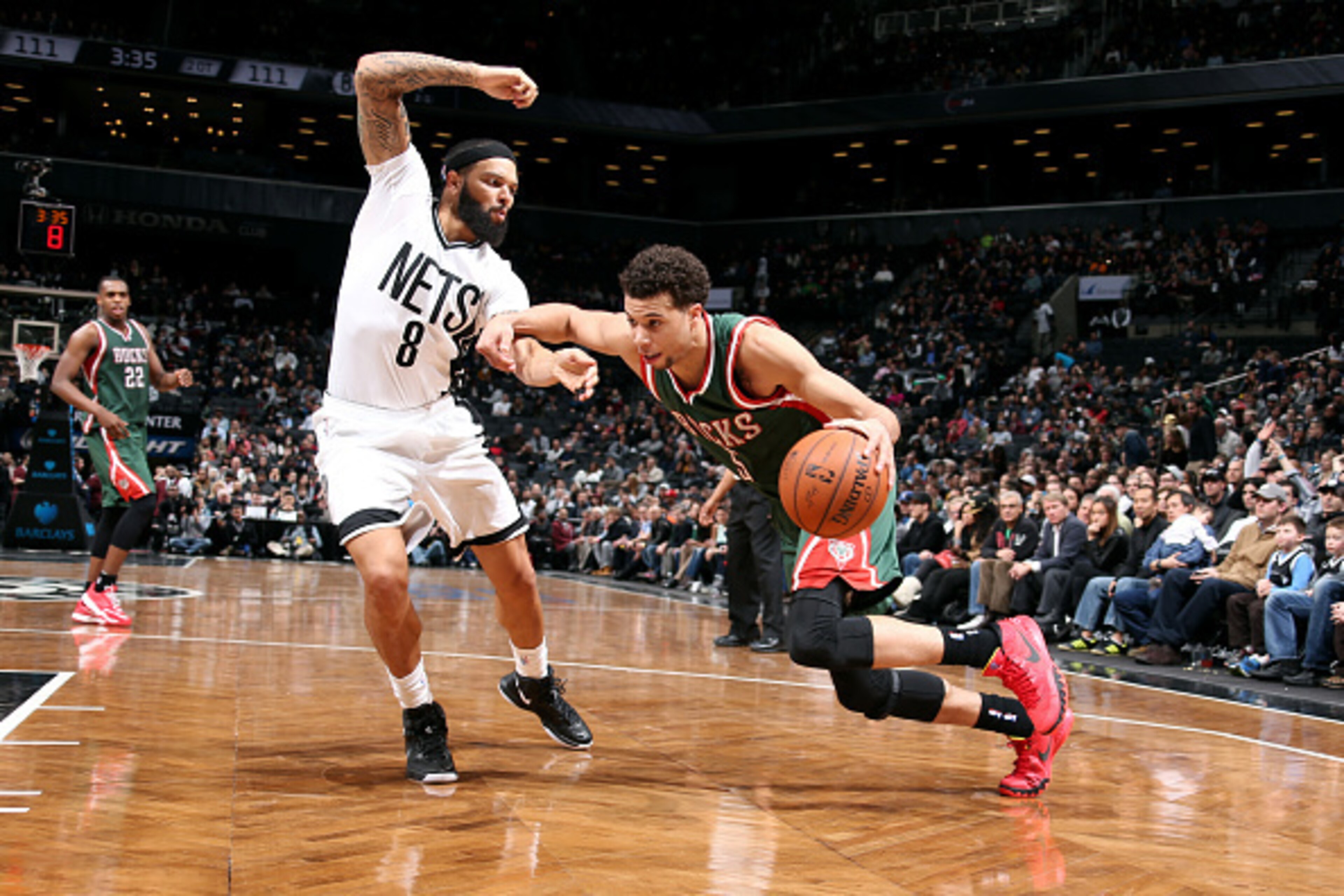 BROOKLYN, NY - MARCH 20: Michael Carter-Williams #5 of the Milwaukee Bucks drives against Deron Williams #8 of the Brooklyn Nets on March 20, 2015 at Barclays Center in Brooklyn, New York. NOTE TO USER: User expressly acknowledges and agrees that, by down