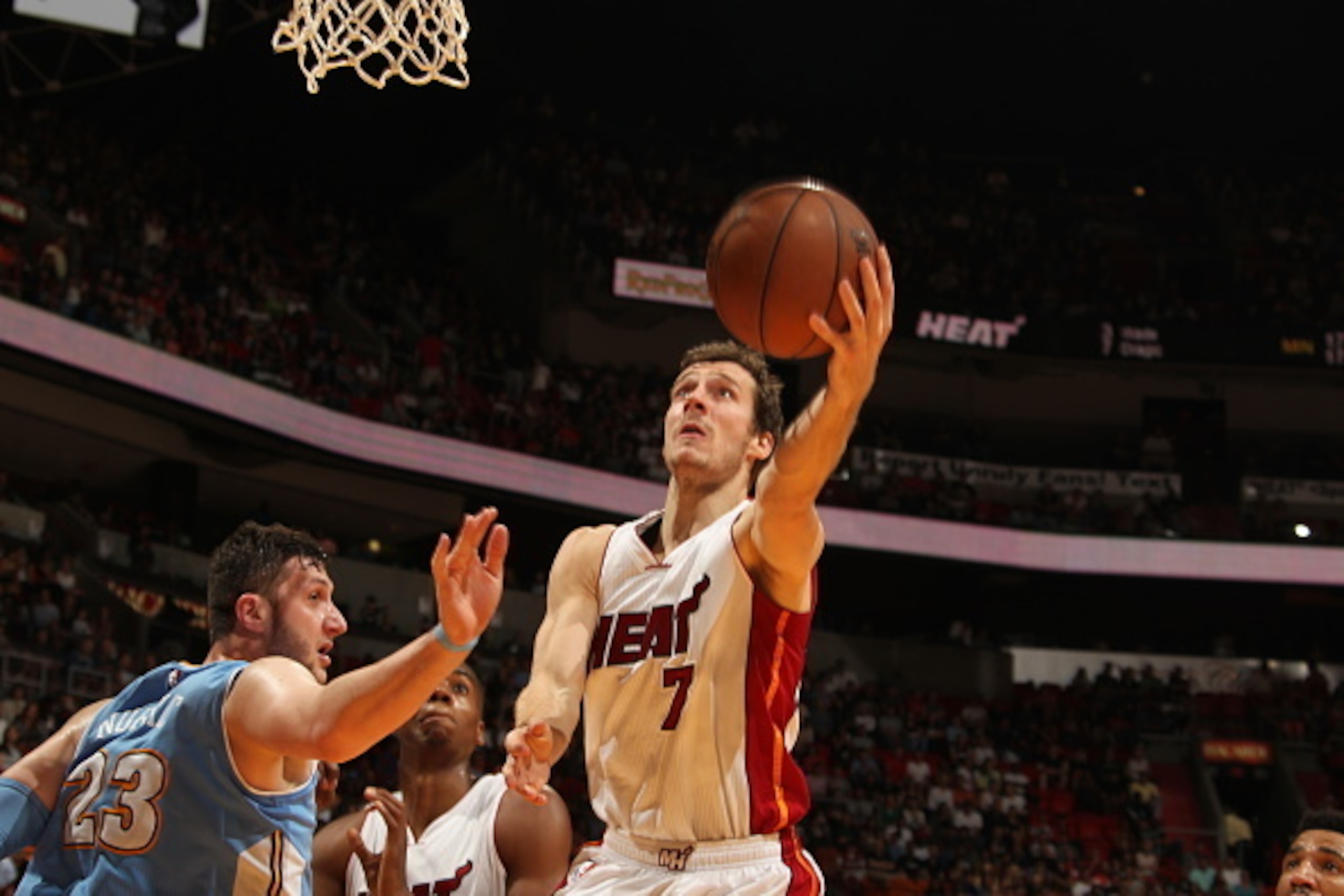 MIAMI, FL - MARCH 20:  Goran Dragic #7 of the Miami Heat goes to the basket against the Denver Nuggets on March 20, 2015 at American Airlines Arena in Miami, Florida.  NOTE TO USER: User expressly acknowledges and agrees that, by downloading and or using 