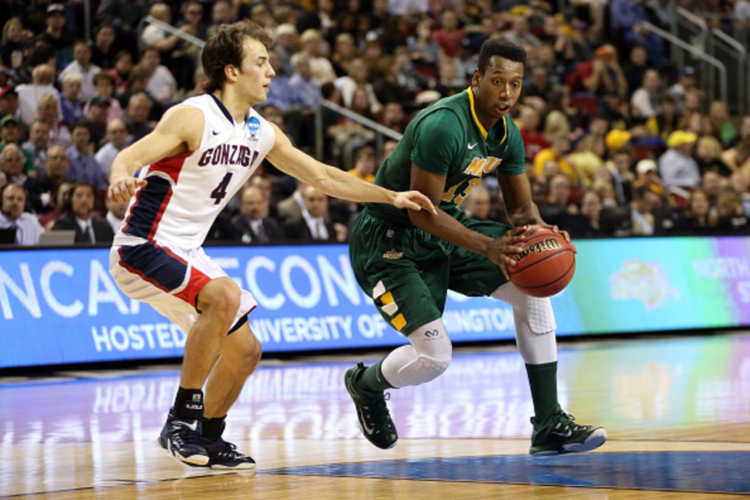 SEATTLE, WA - MARCH 20:  Carlin Dupree #13 of the North Dakota State Bison dribbles the ball against Kevin Pangos #4 of the Gonzaga Bulldogs in the first half of the game during the second round of the 2015 NCAA Men's Basketball Tournament at KeyArena on 