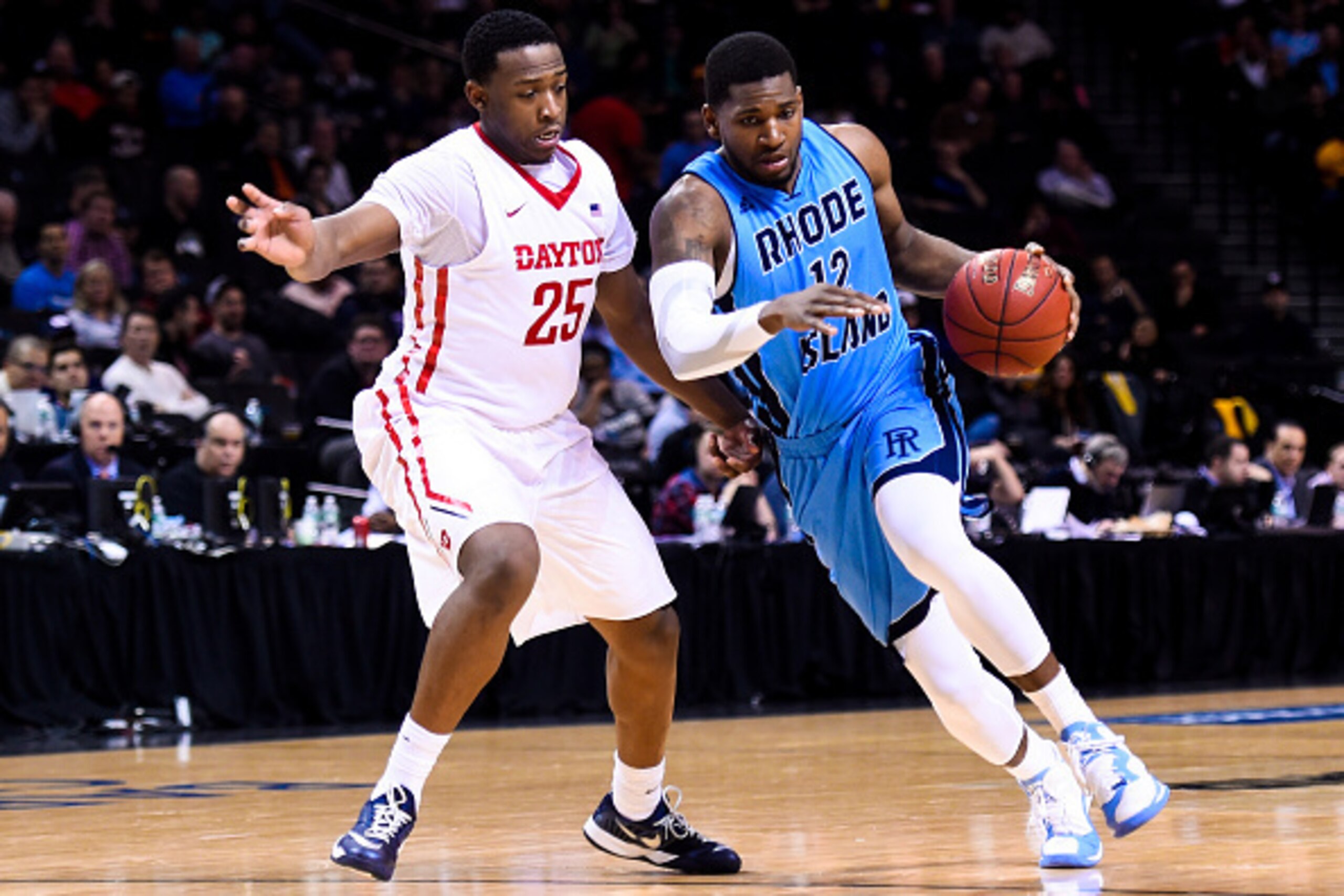 NEW YORK, NY - MARCH 14:  Hassan Martin #12 of the Rhode Island Rams attempts to dribble around Kendall Pollard #25 of the Dayton Flyers during a semifinal game in the 2015 Men's Atlantic 10 Basketball Tournament at the Barclays Center on March 14, 2015 i