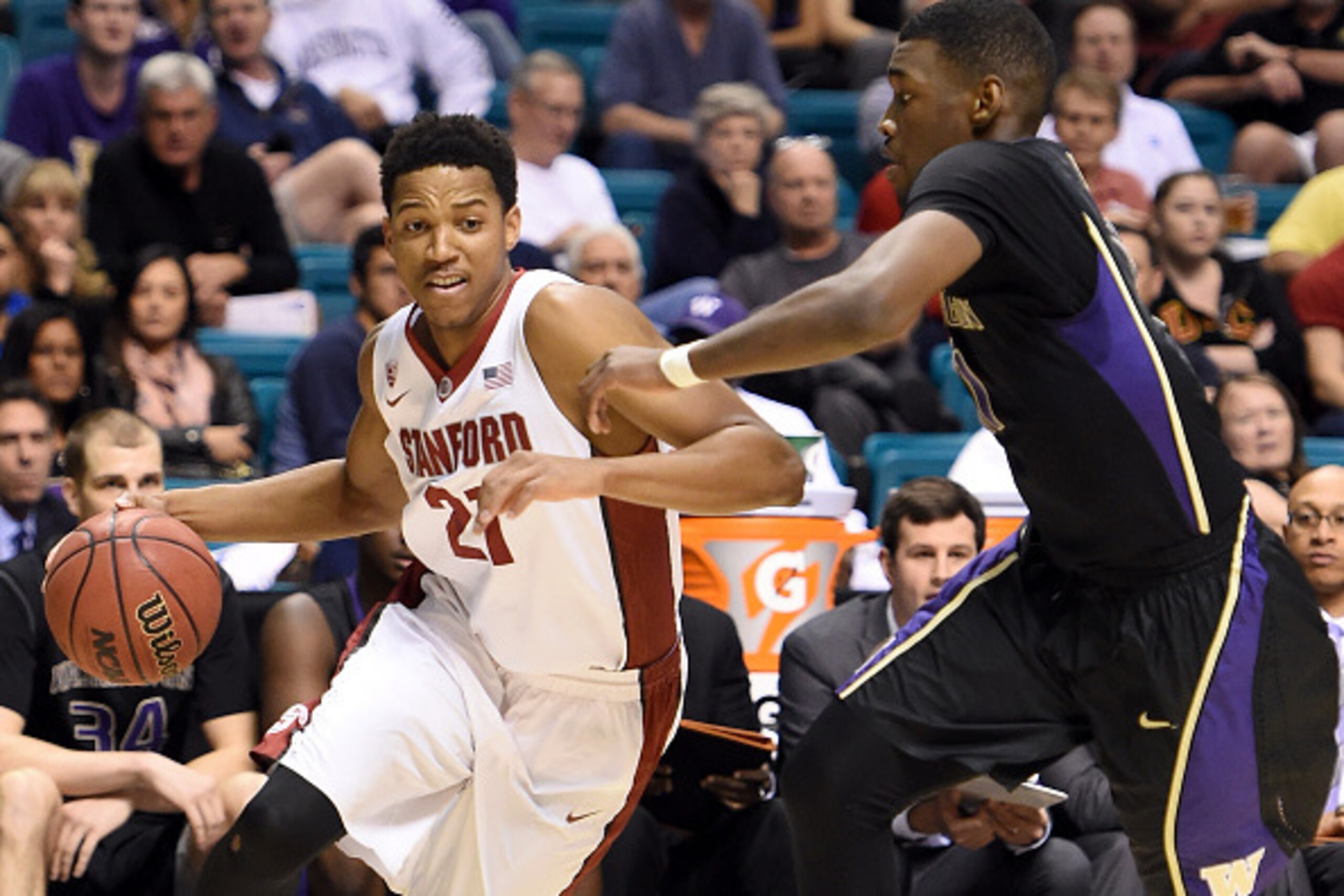 LAS VEGAS, NV - MARCH 11:  Anthony Brown #21 of the Stanford Cardinal drives against Mike Anderson #11 of the Washington Huskies during a first-round game of the Pac-12 Basketball Tournament at the MGM Grand Garden Arena on March 11, 2015 in Las Vegas, Ne