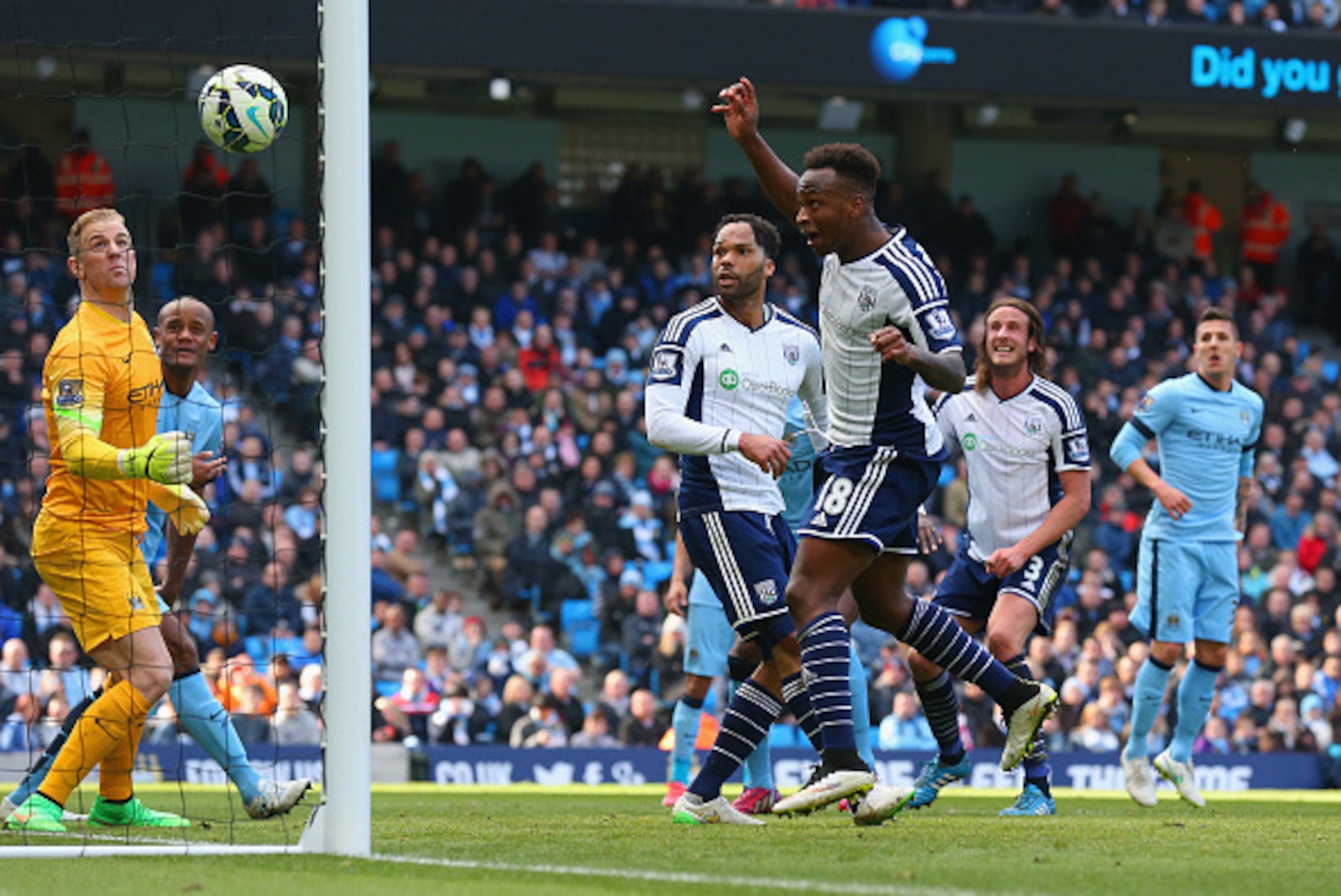 MANCHESTER, ENGLAND - MARCH 21: Joe Hart of Manchester City looks on as Saido Berahino of West Brom hits the cross bar during the Barclays Premier League match between Manchester City and West Bromwich Albion at Etihad Stadium on March 21, 2015 in Manches